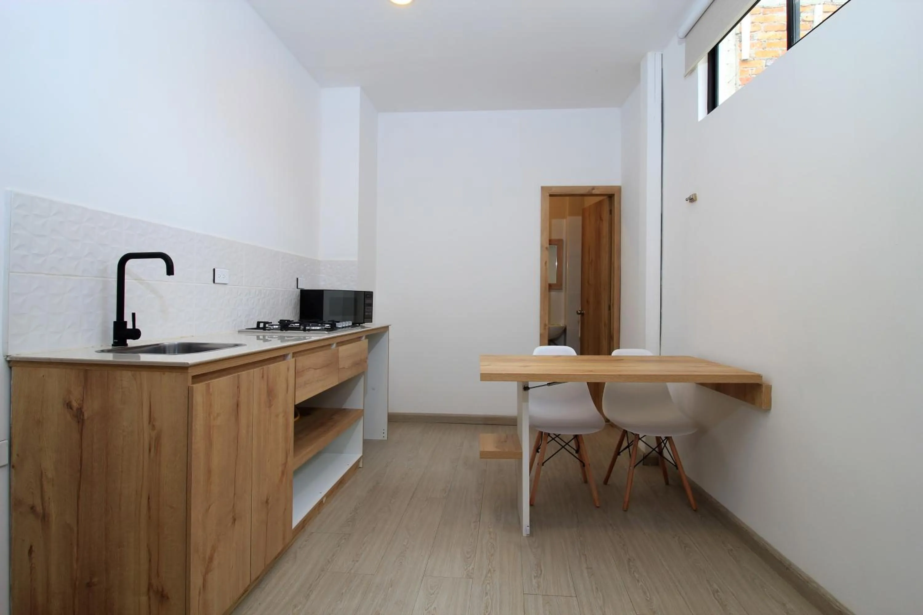 Kitchen or kitchenette in Apart Hotel Casa Blanca