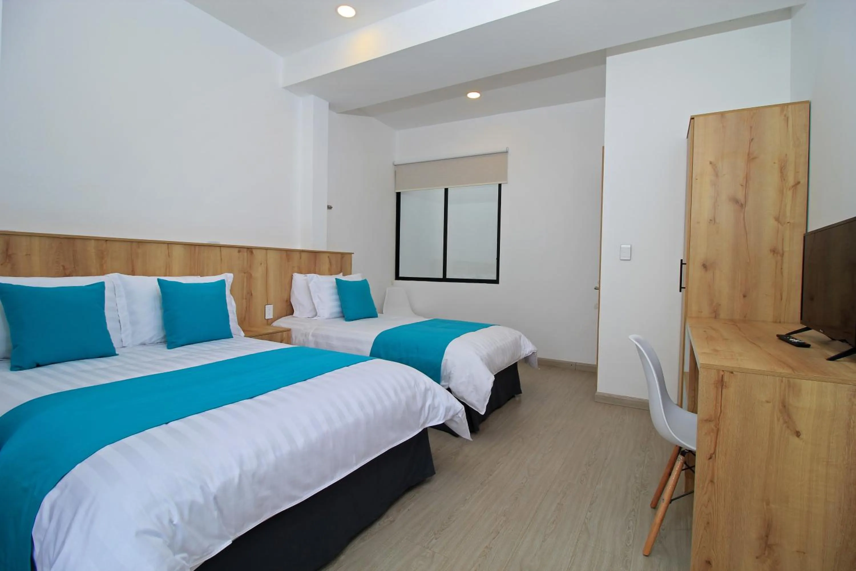 Communal lounge/ TV room, Bed in Apart Hotel Casa Blanca