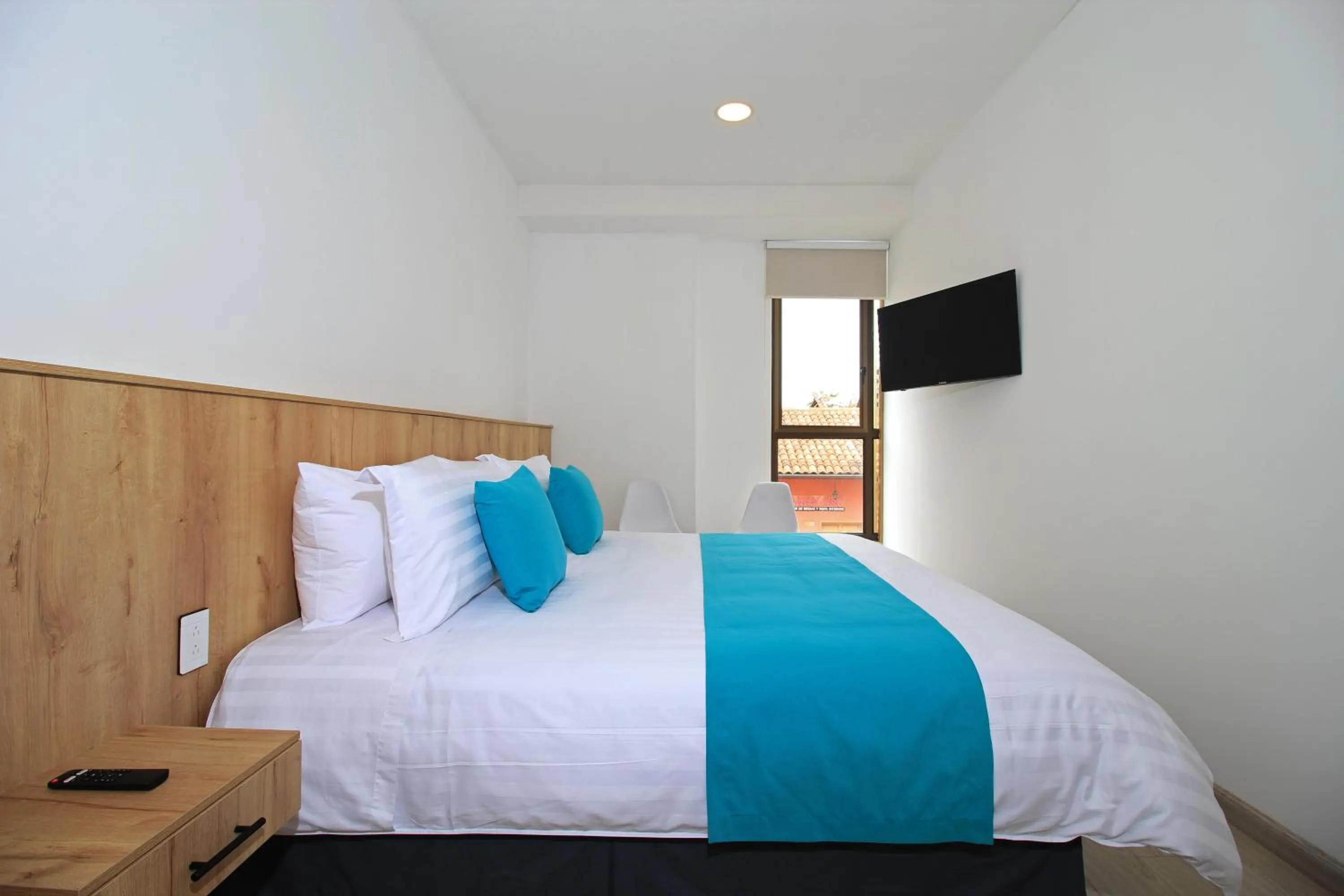 Bed in Apart Hotel Casa Blanca