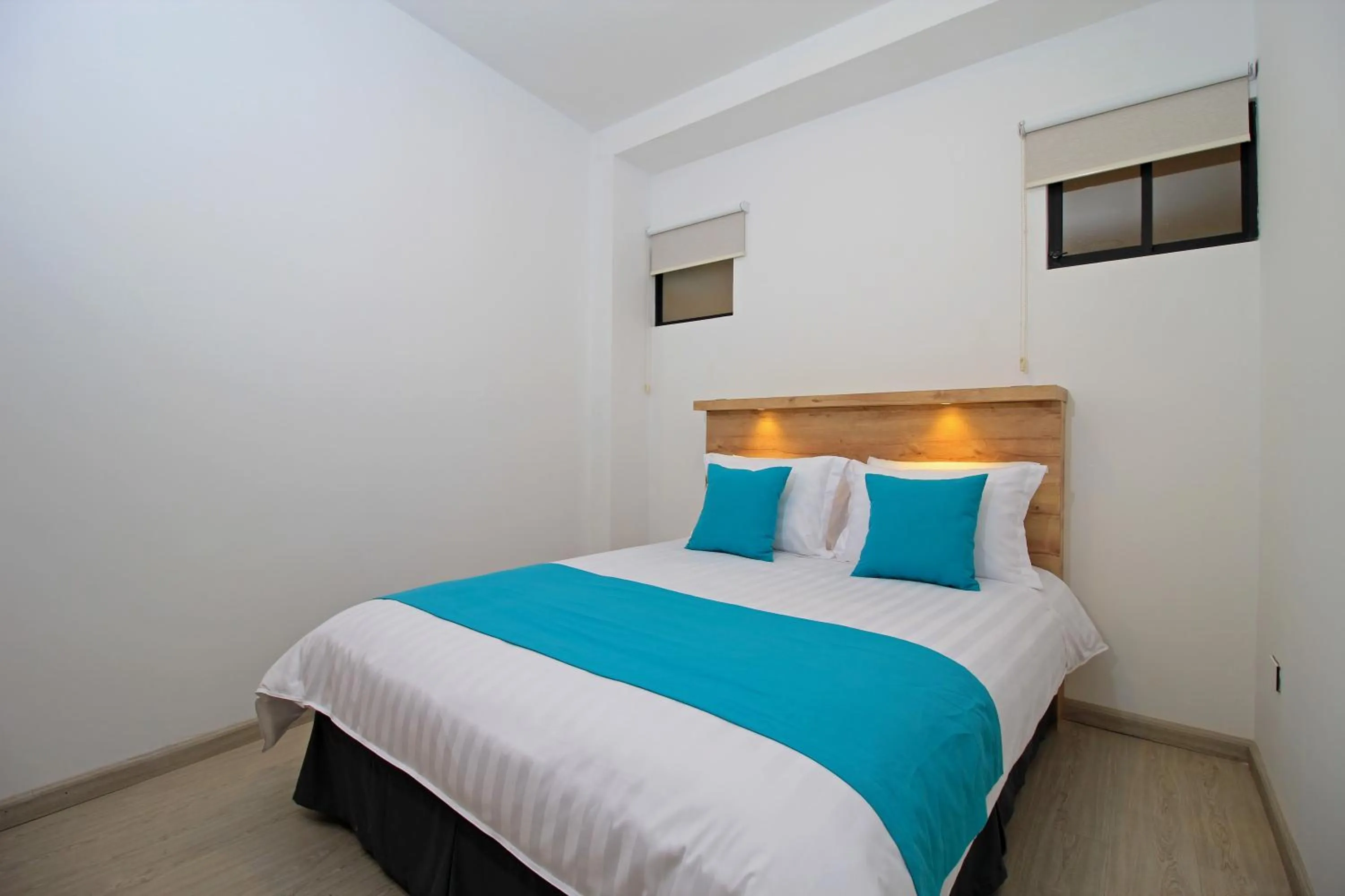 Bed in Apart Hotel Casa Blanca