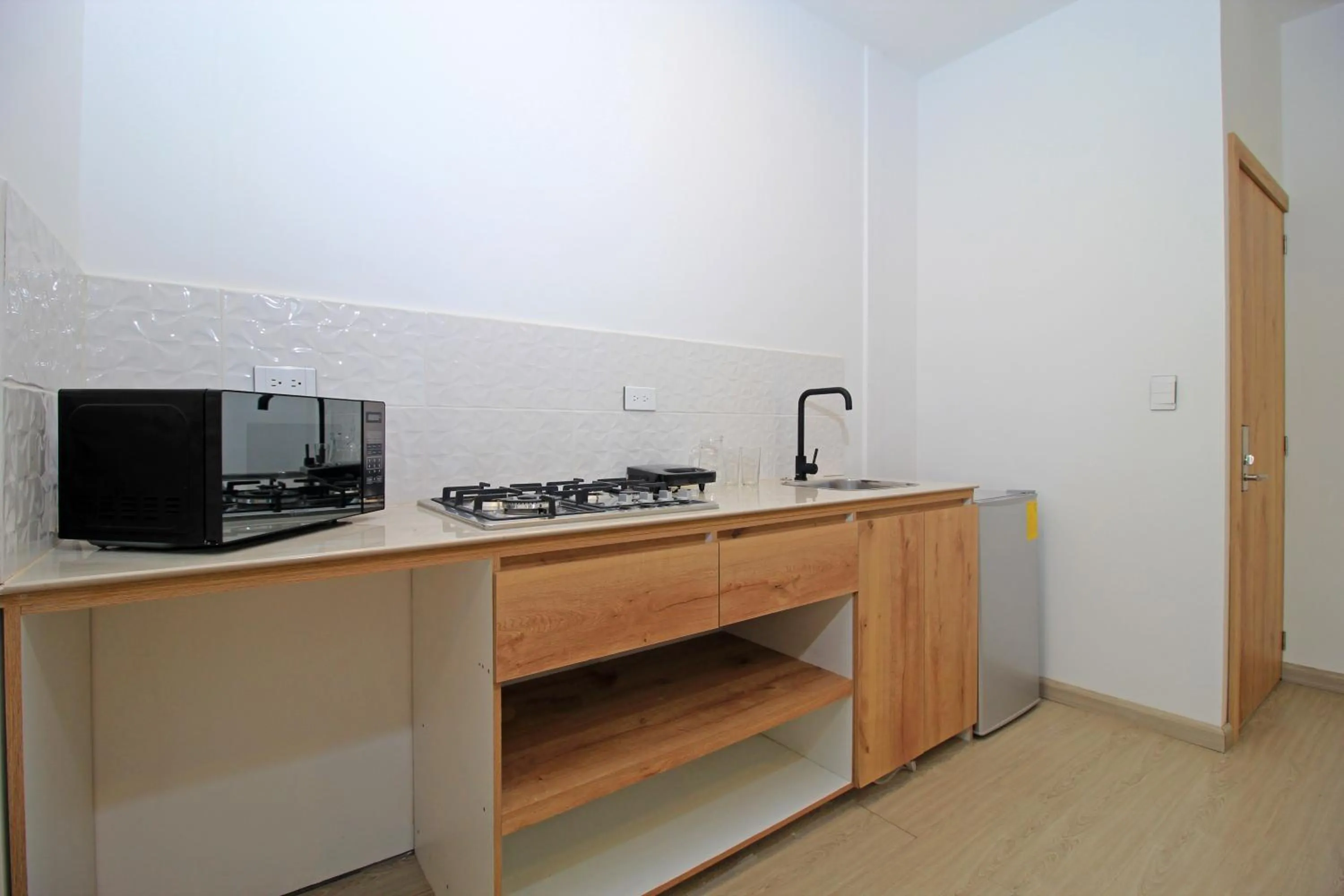 Kitchen or kitchenette in Apart Hotel Casa Blanca