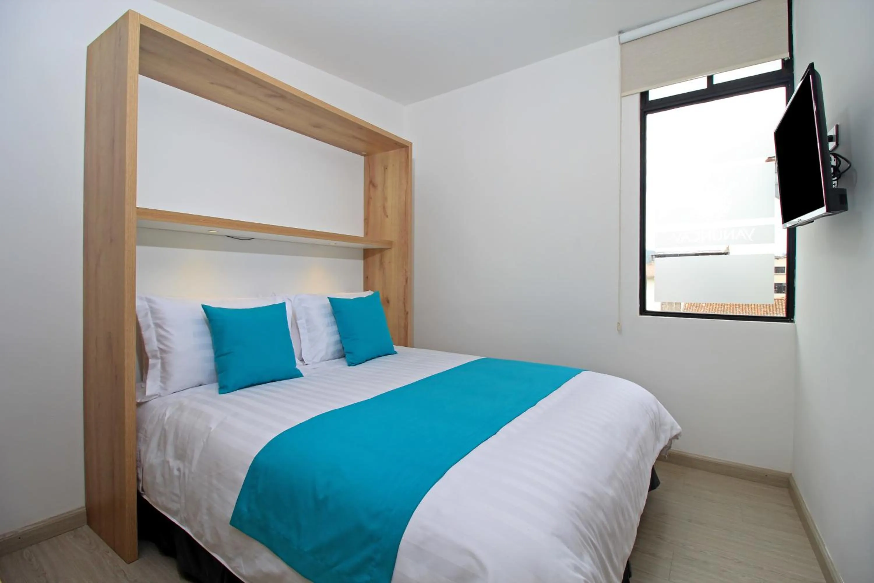 Bed in Apart Hotel Casa Blanca