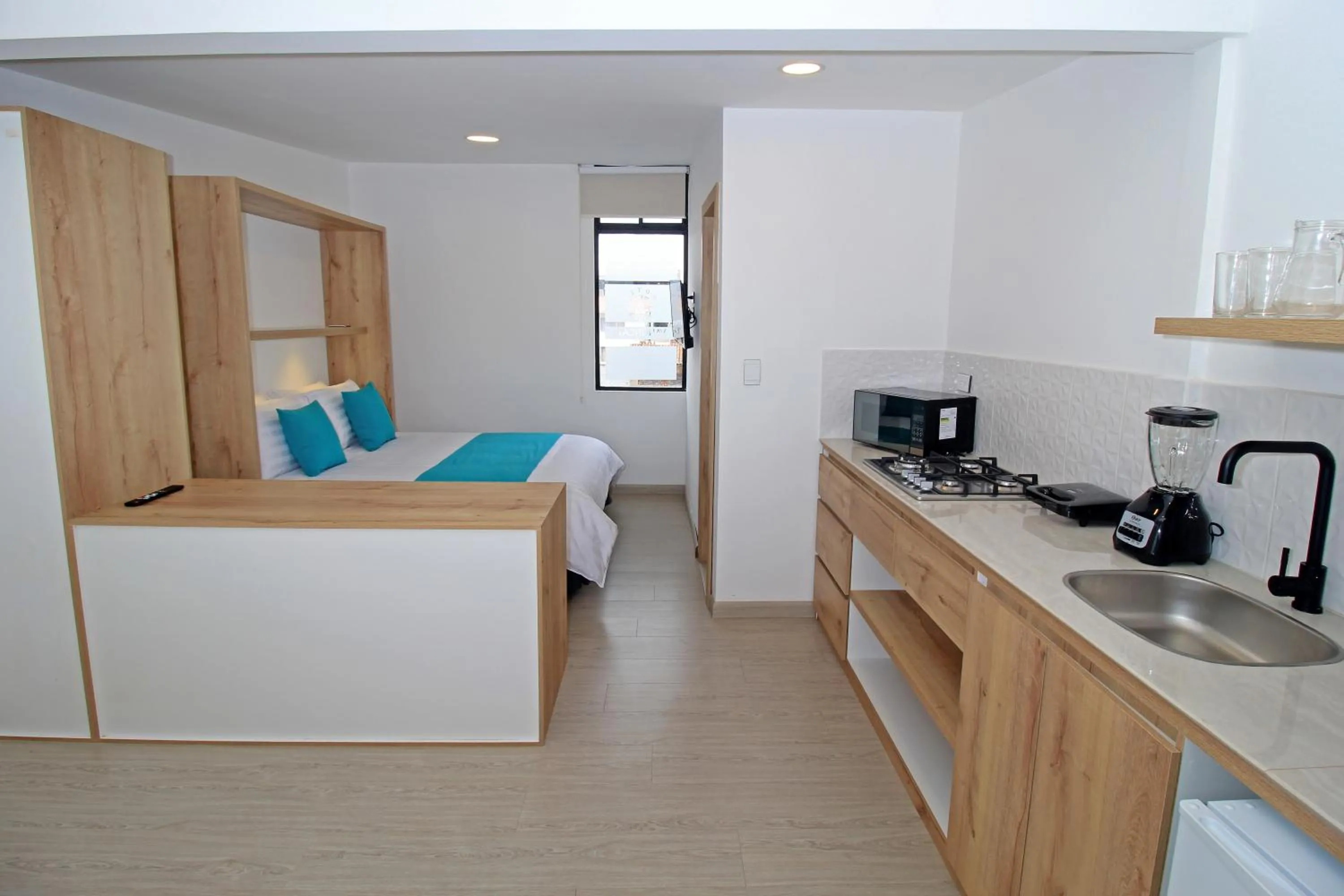 Kitchen or kitchenette, Bed in Apart Hotel Casa Blanca