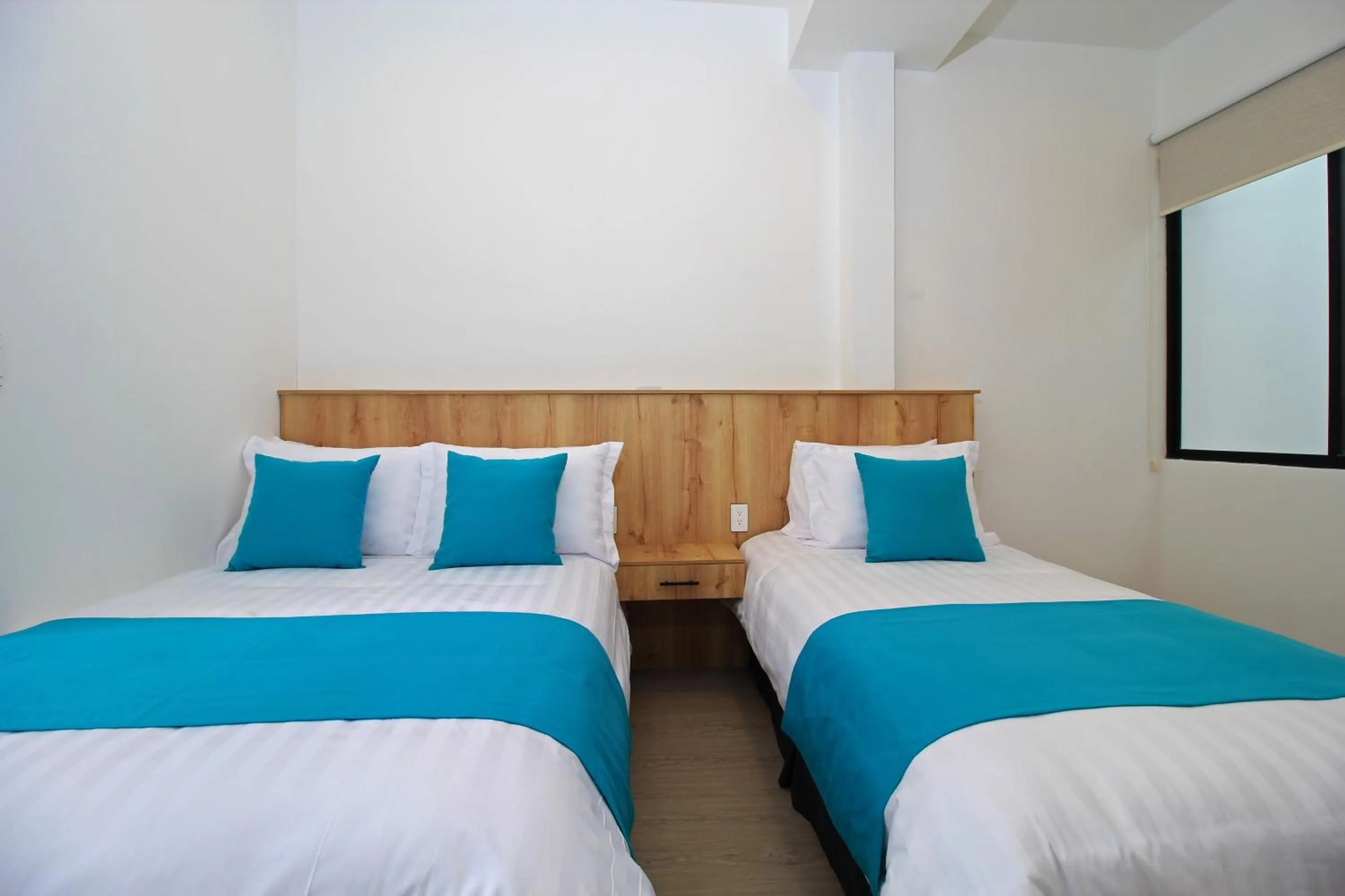 Bed in Apart Hotel Casa Blanca