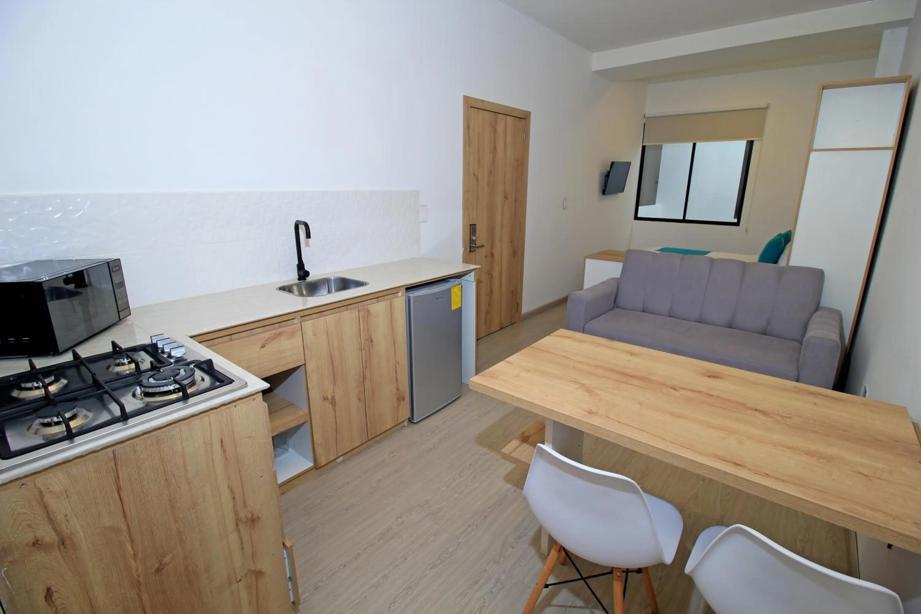 Kitchen or kitchenette in Apart Hotel Casa Blanca