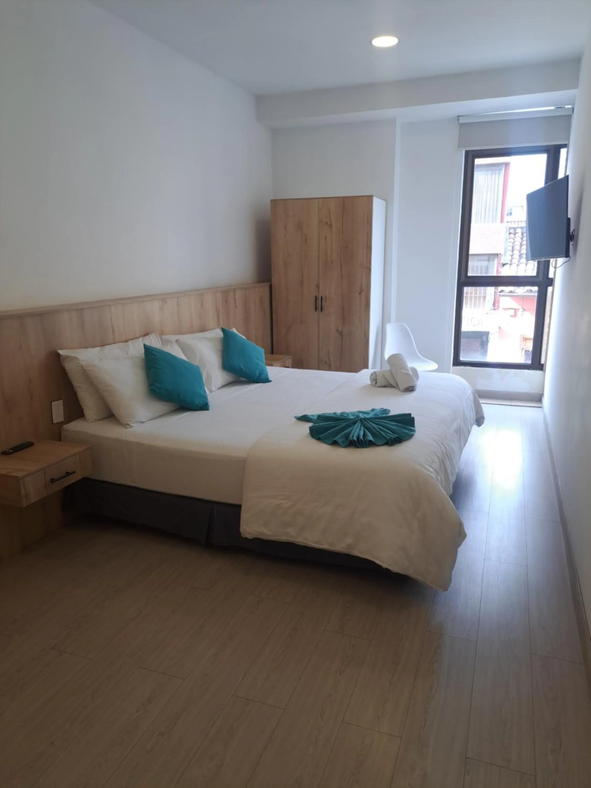 Bed in Apart Hotel Casa Blanca