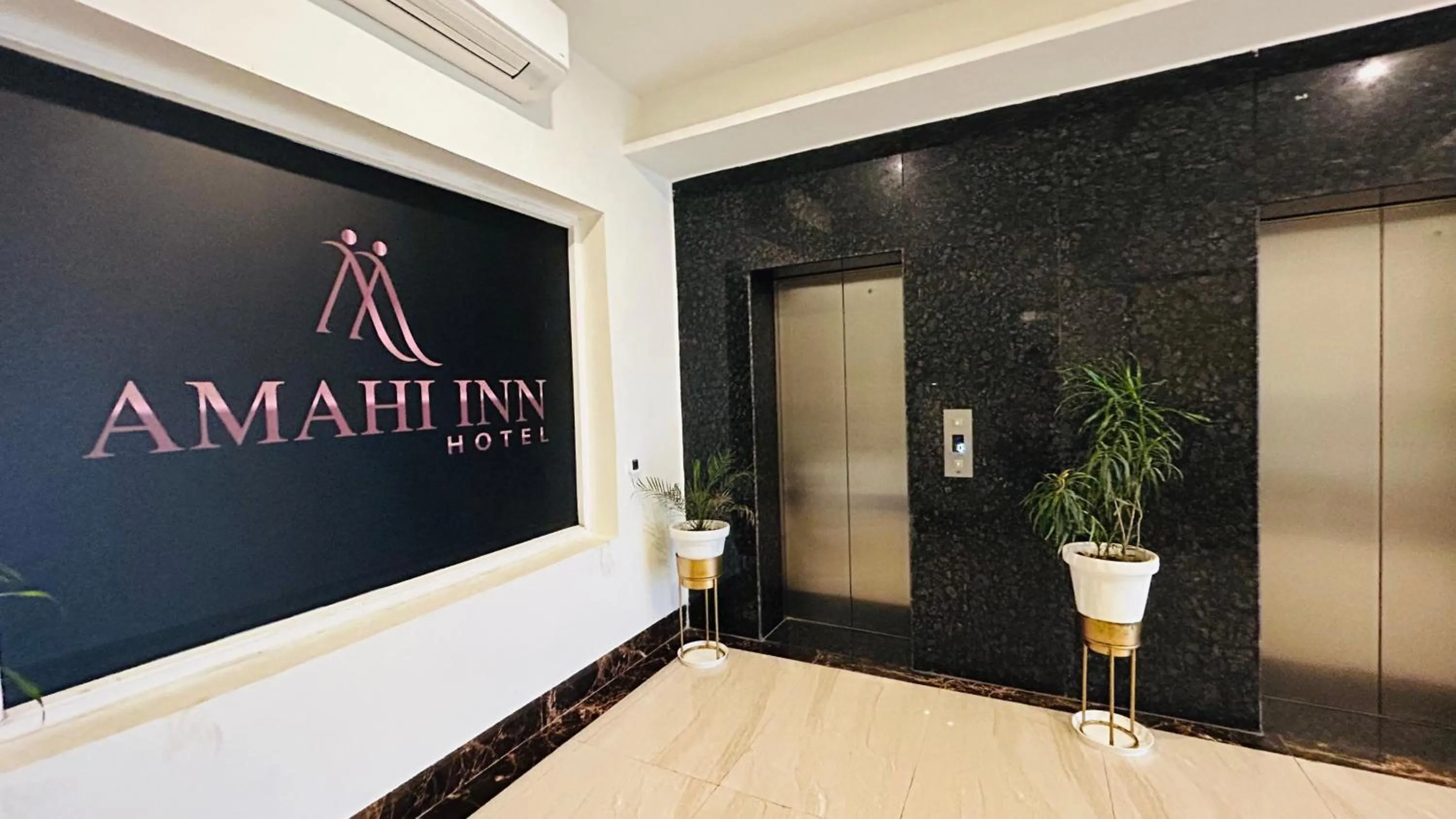 Property logo or sign in Amahi Inn I Signature Towers