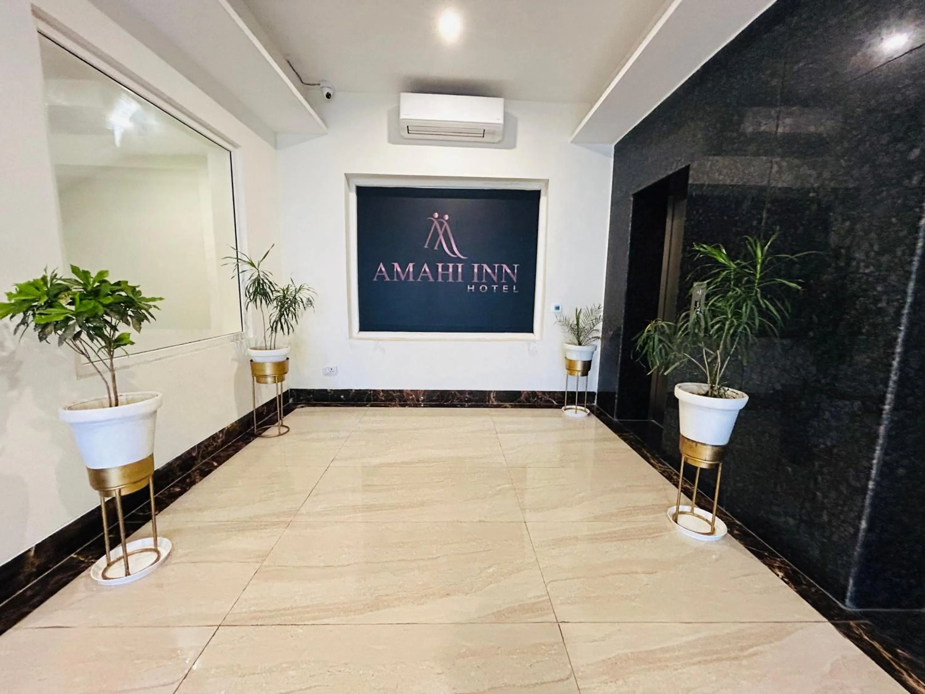 Property logo or sign in Amahi Inn I Signature Towers
