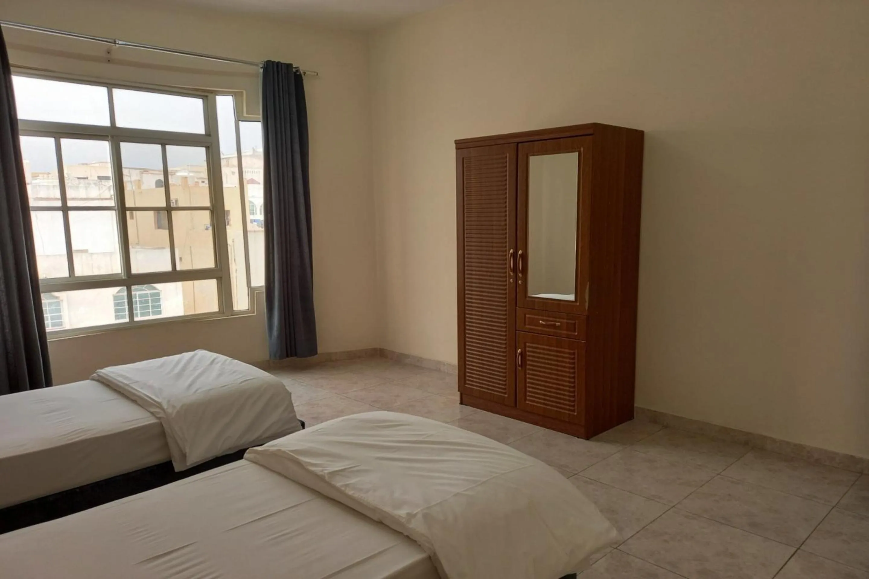 Bedroom, Bed in Super OYO 147 Babylon Furnished Apartment