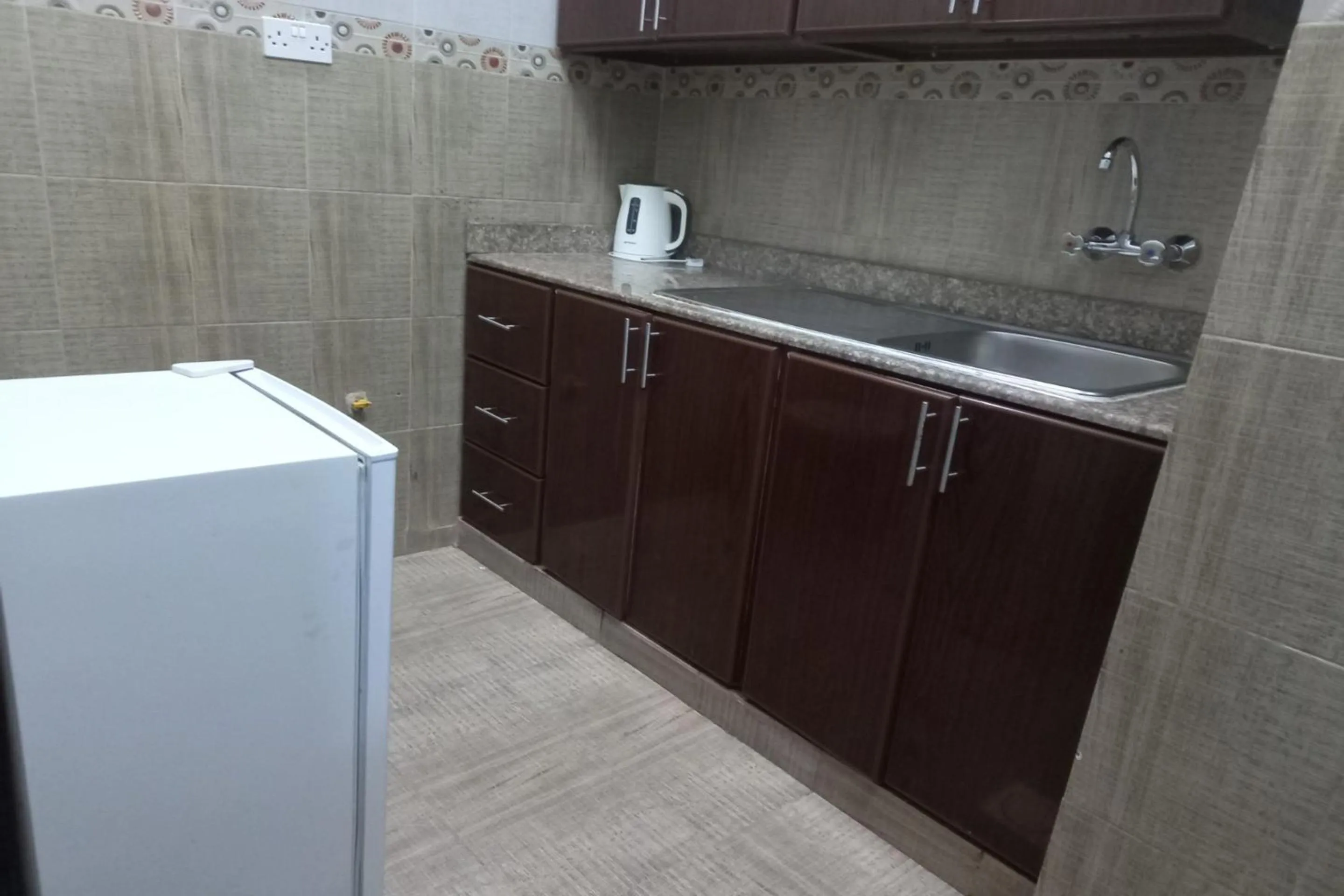 Bedroom in Super OYO 147 Babylon Furnished Apartment