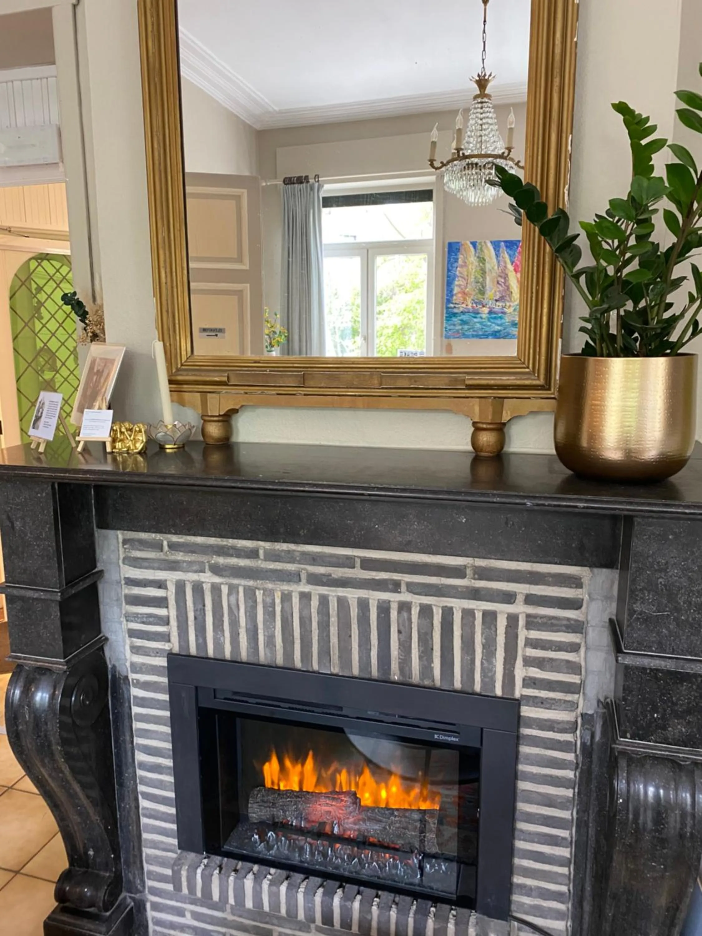 fireplace in Hotel Entree - Canal View Bruges