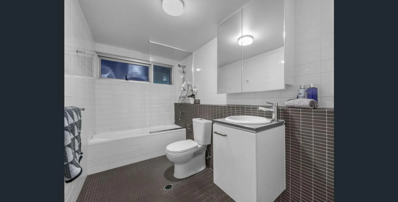Toilet in Story Apartments