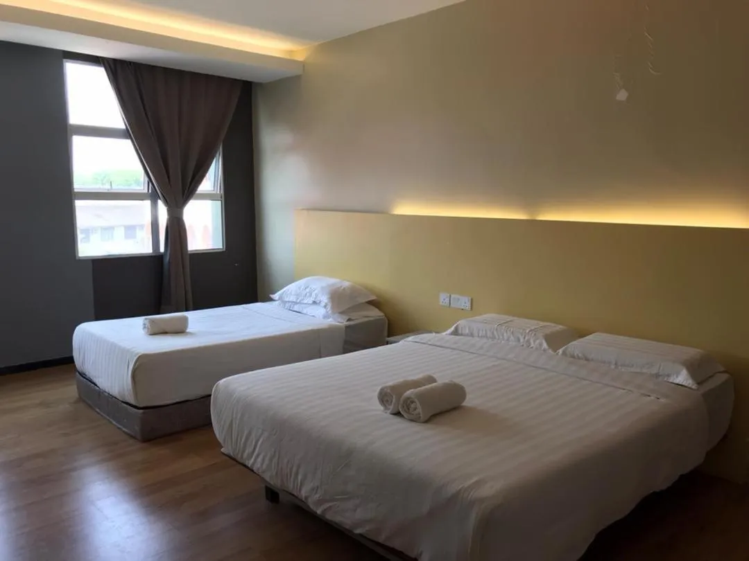 Bed in TOWERMAS HOTEL