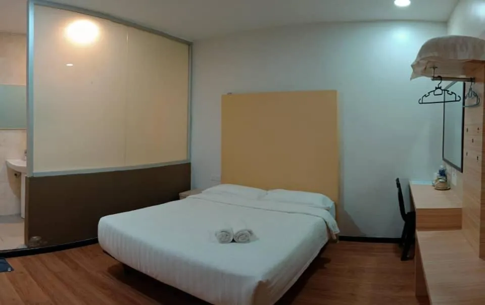 Bed in TOWERMAS HOTEL