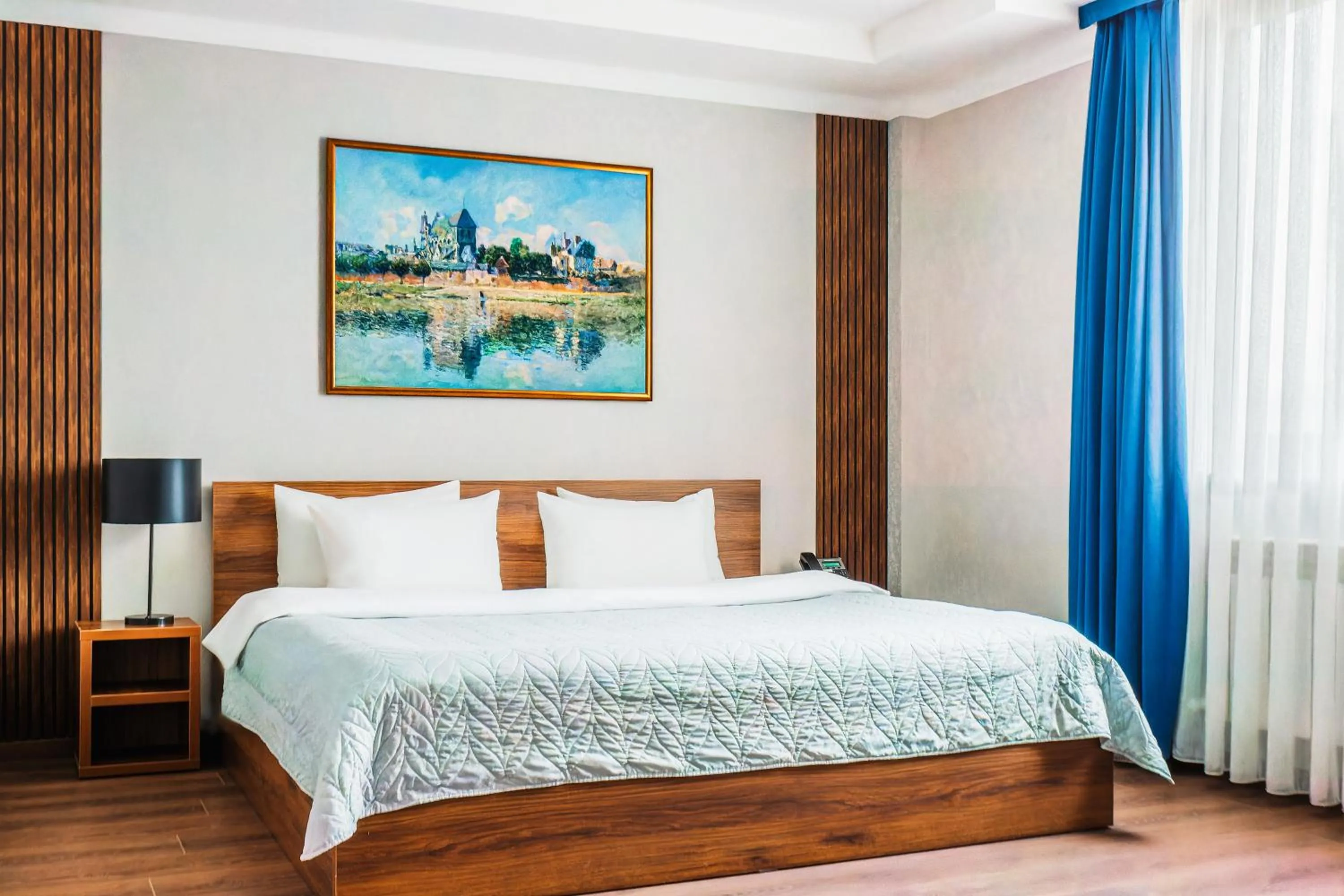 Bed in RICH PARK HOTEL