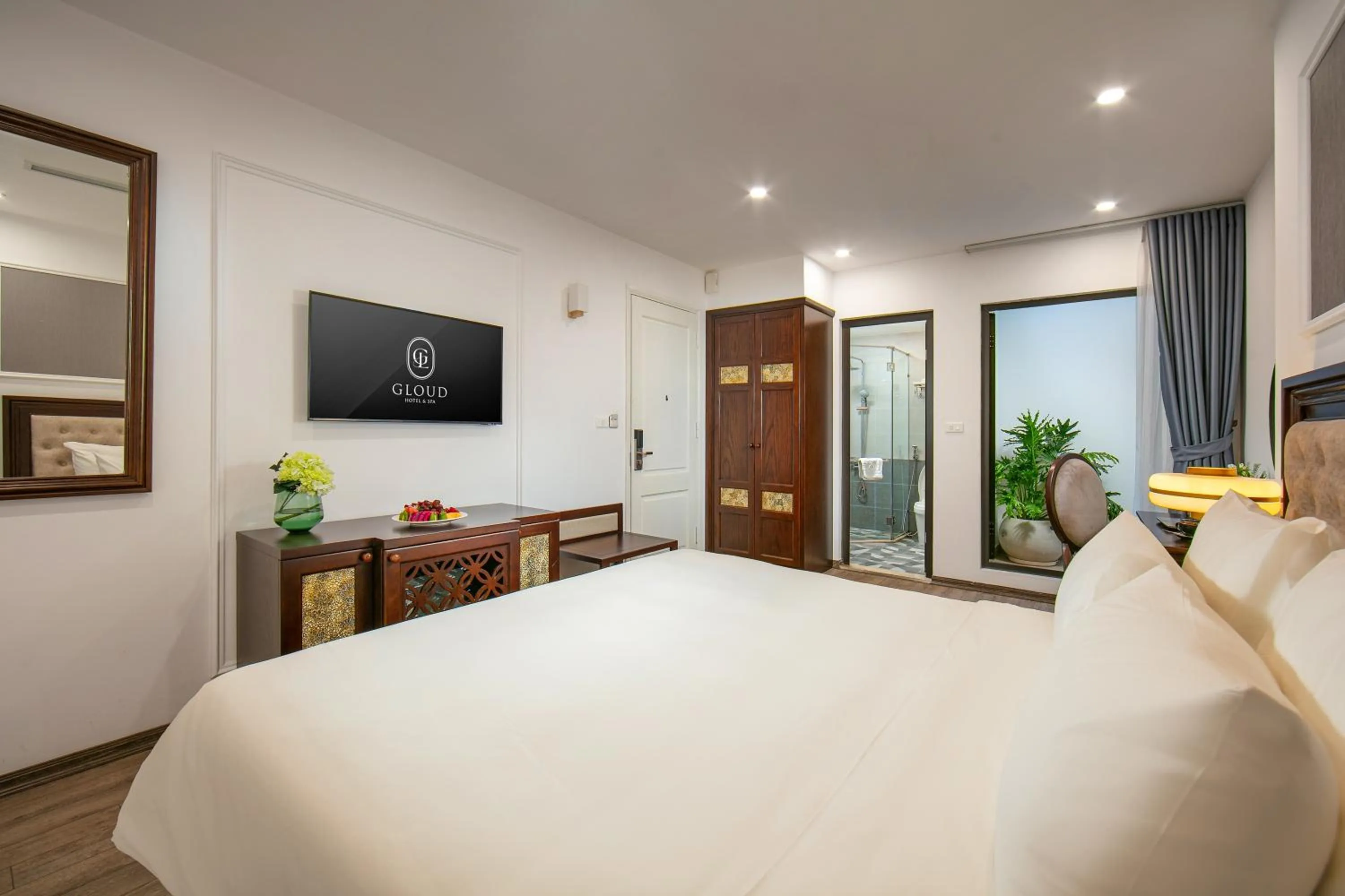 Communal lounge/ TV room, Bed in Gloud Hotel