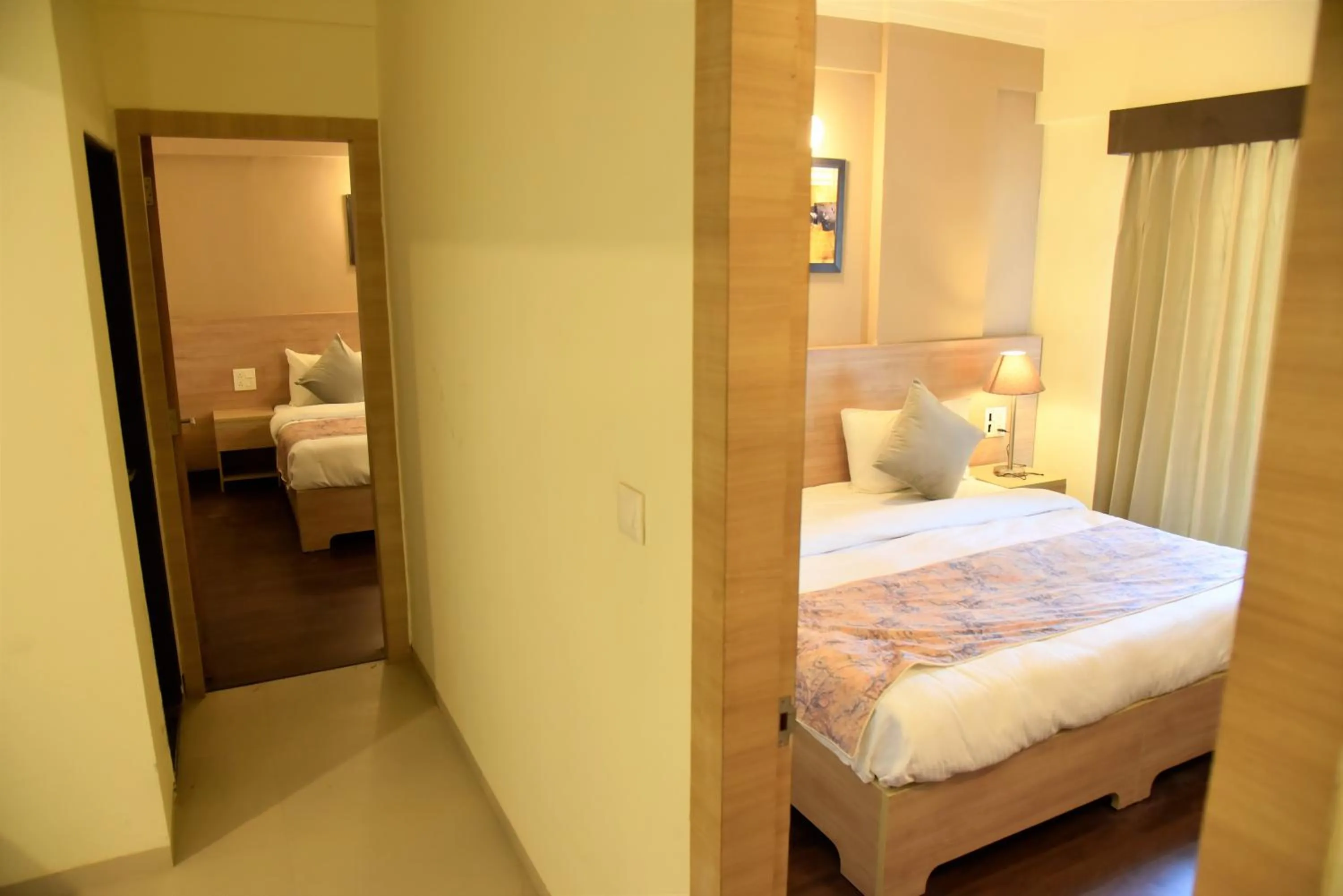 Bedroom in Starlit Suites Shirdi
