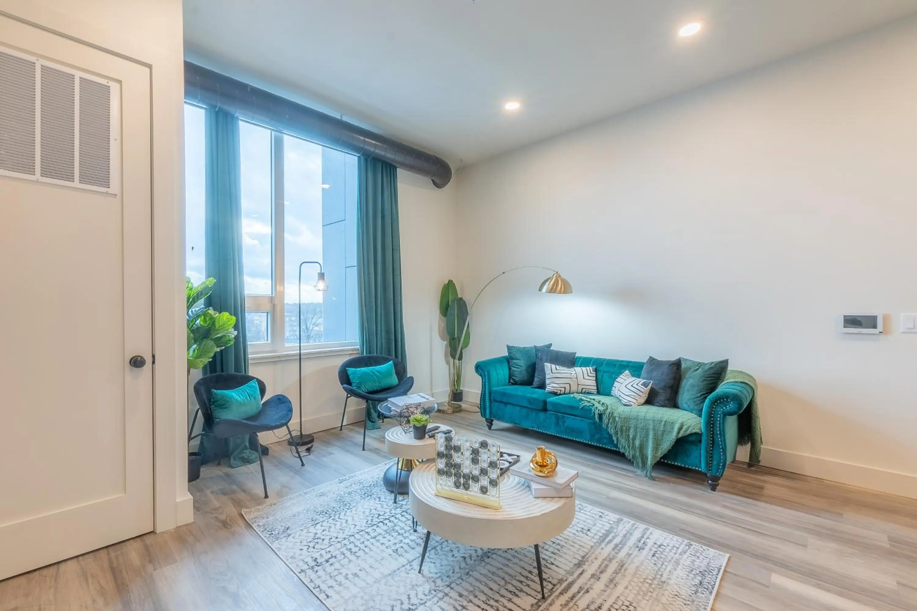 Living room in Emerald Escape, Free Parking, 2 Bath, Sleeps 8 Near American Dream and The Airport, King Bed and 2 Queen Beds, Washer and Dryer