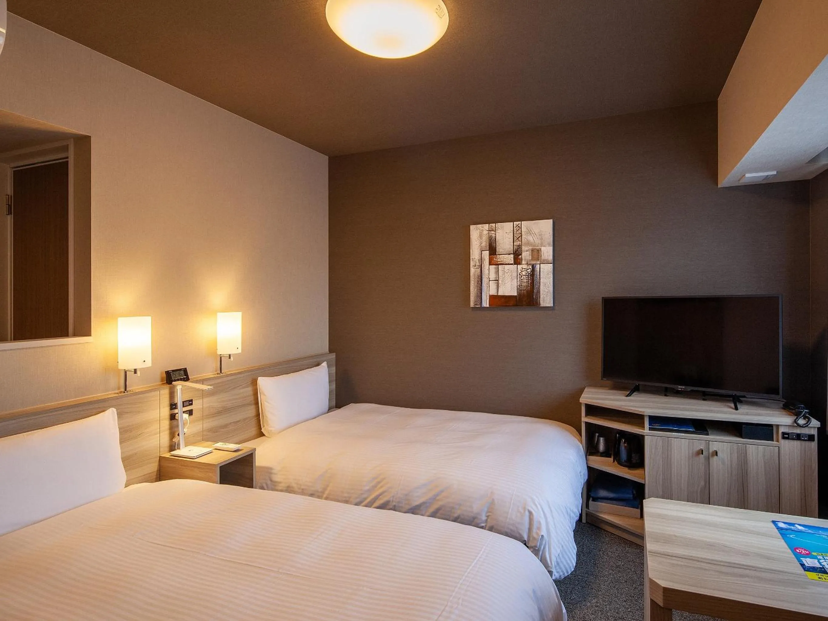 Photo of the whole room, Bed in Hotel Route Inn Miyoshi Ekimae