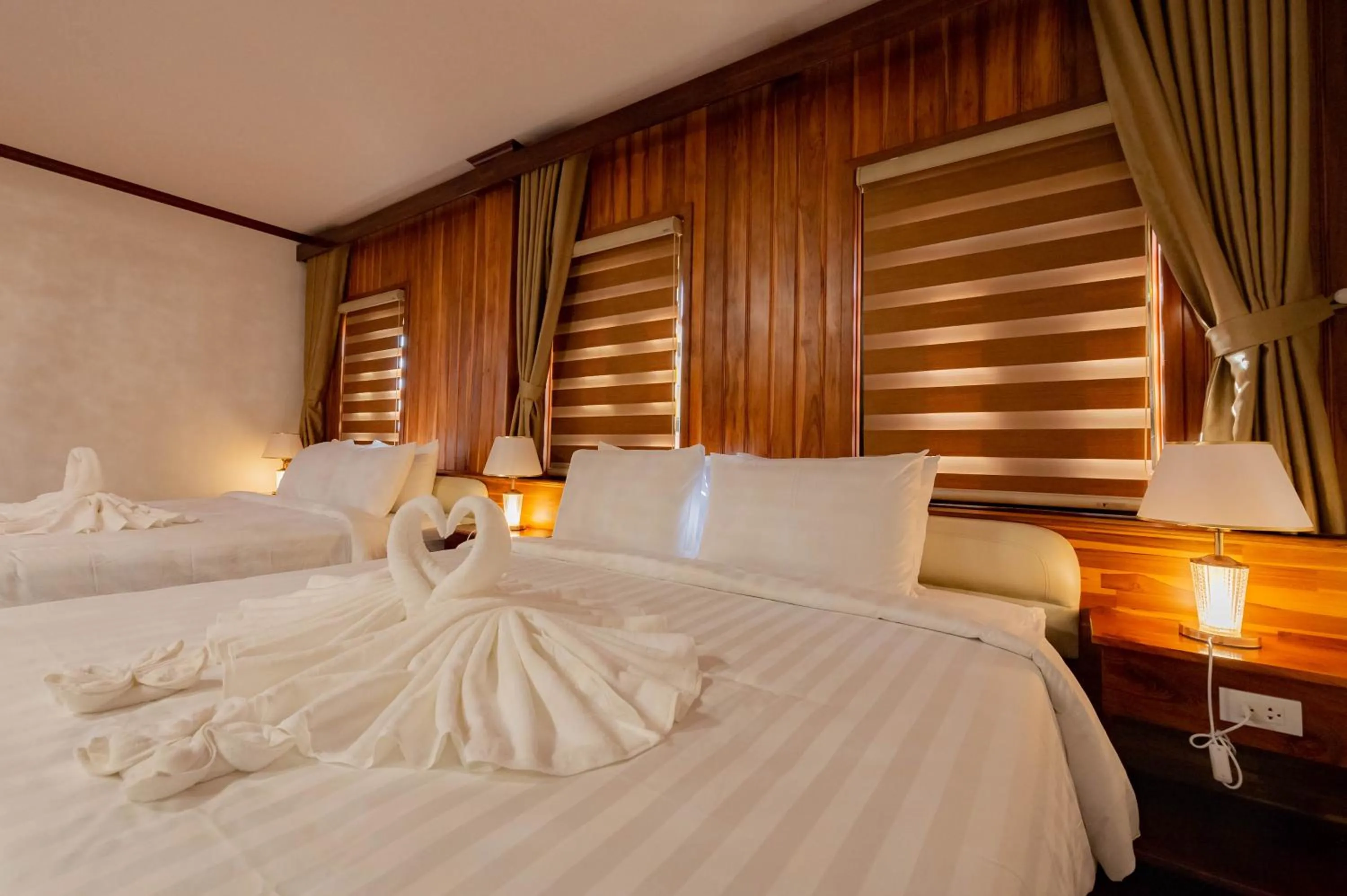 Photo of the whole room, Bed in LuangPrabang Center Hotel