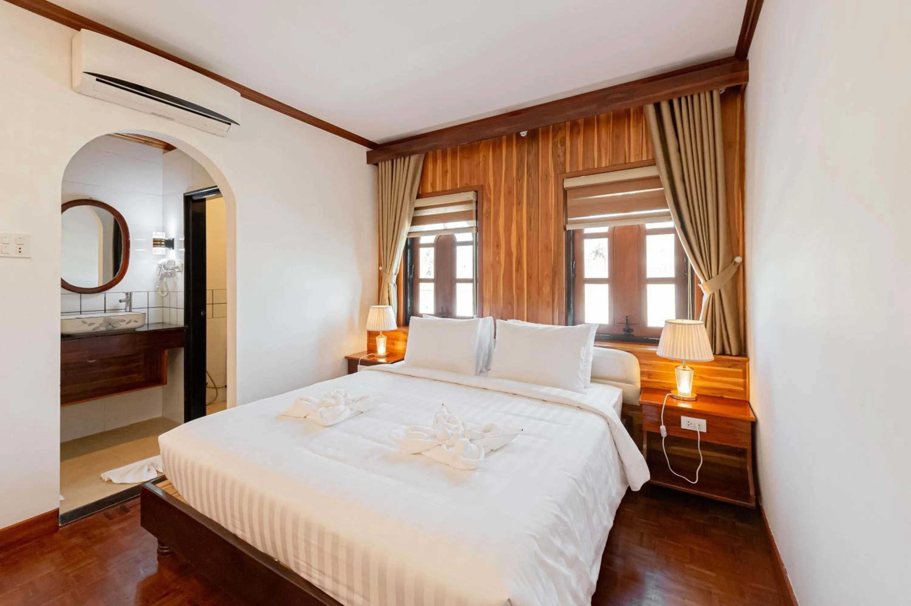 Photo of the whole room, Bed in LuangPrabang Center Hotel