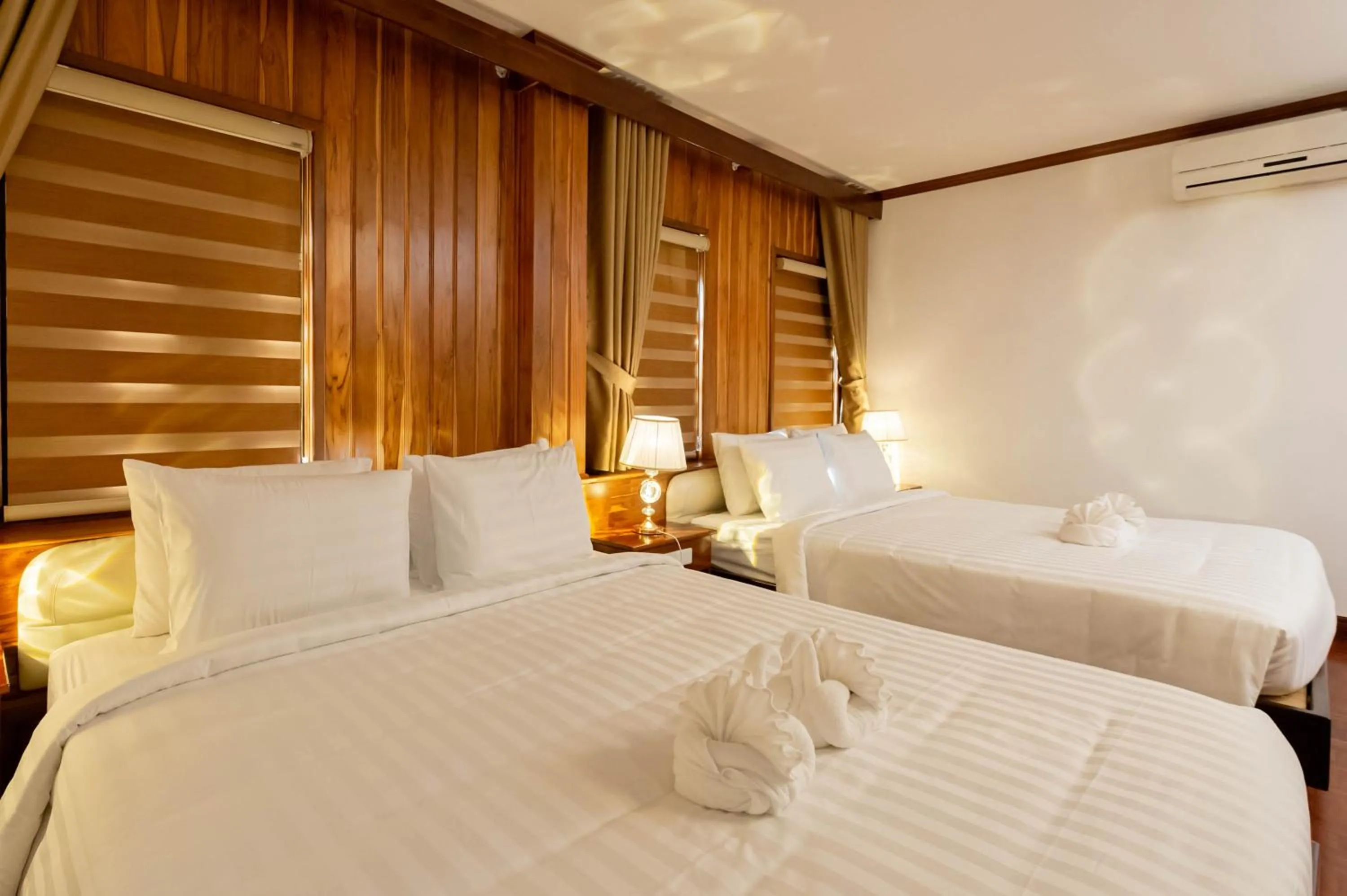 Photo of the whole room, Bed in LuangPrabang Center Hotel