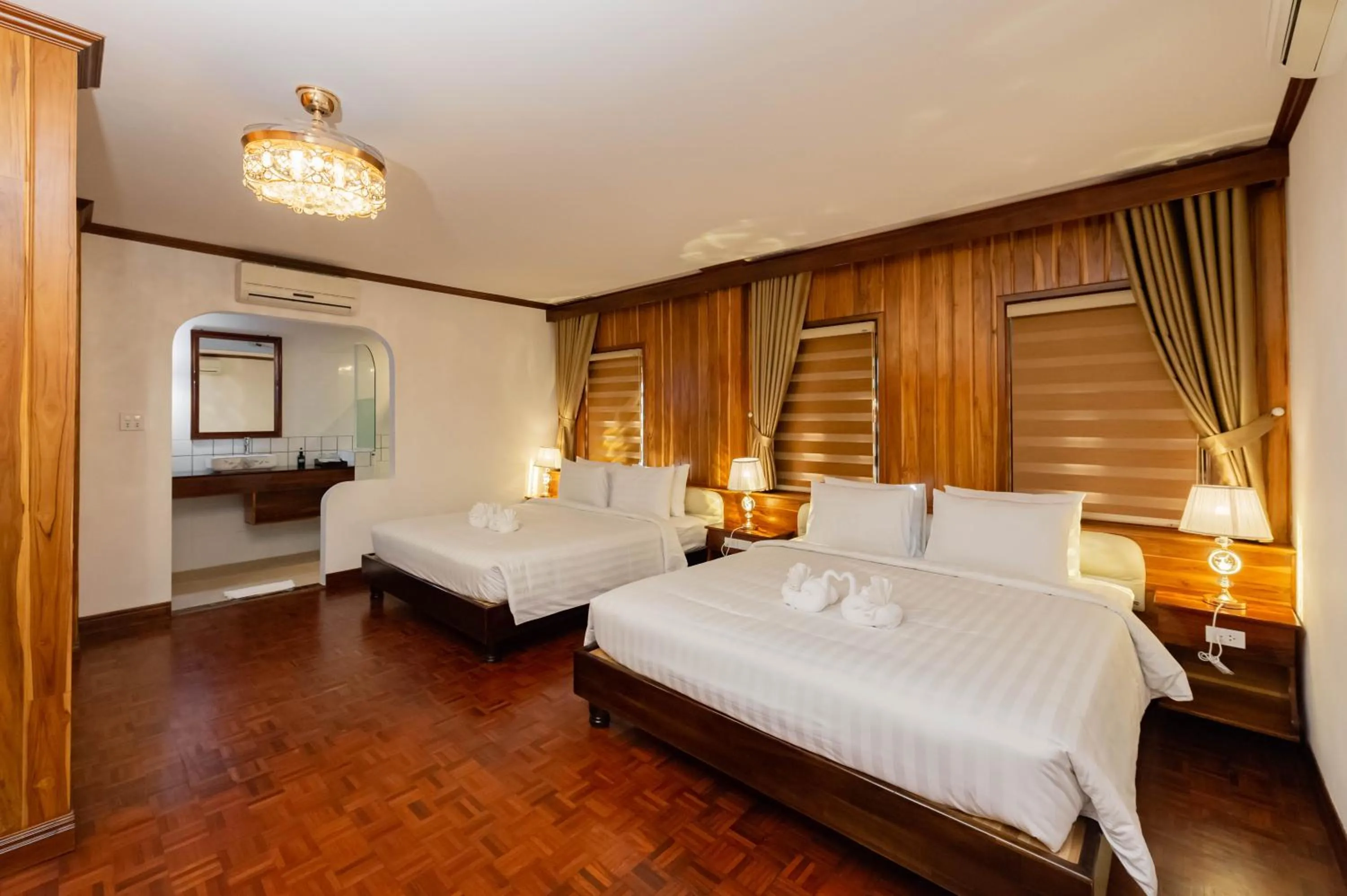 Photo of the whole room, Bed in LuangPrabang Center Hotel