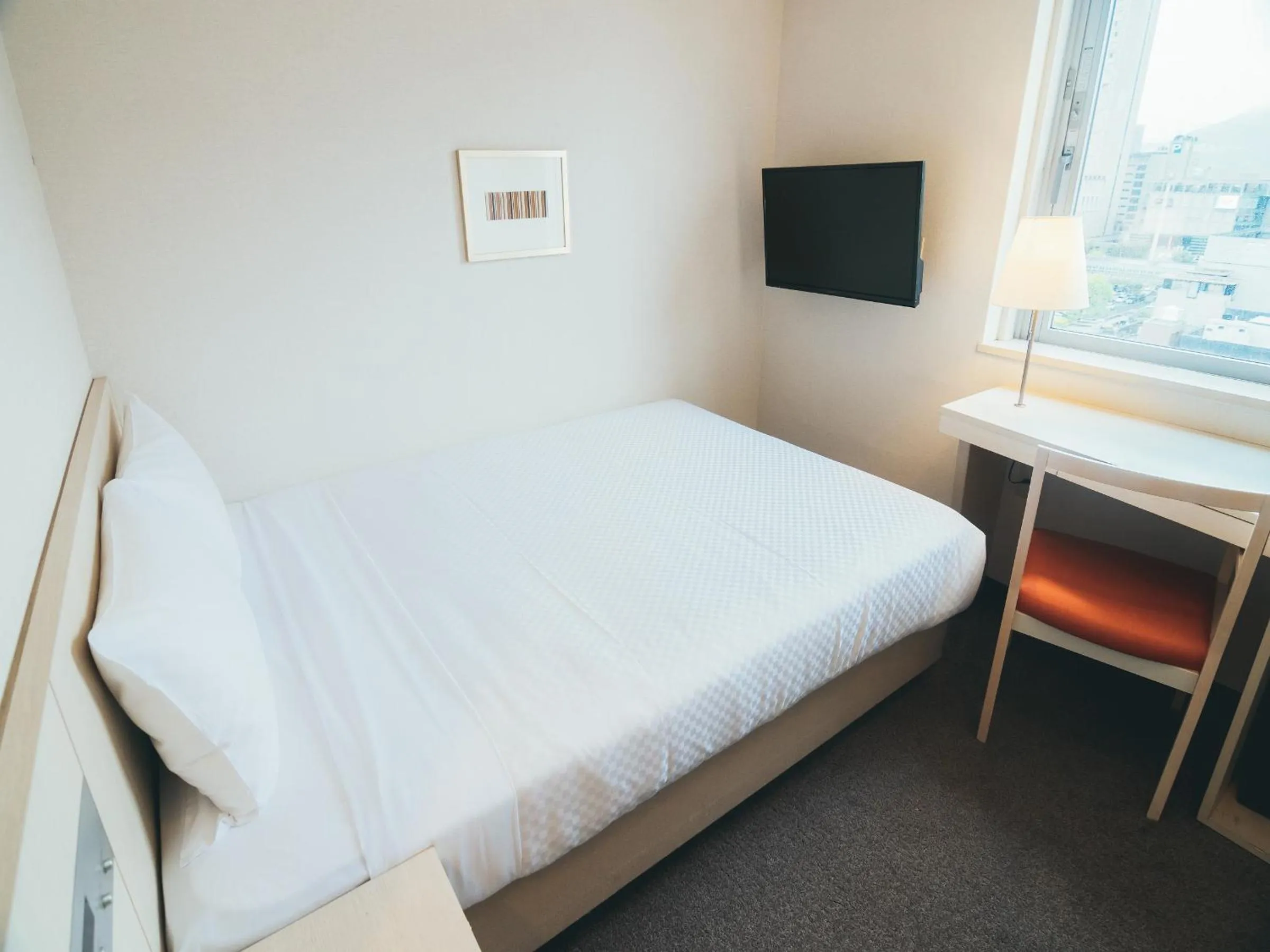 Photo of the whole room, Bed in Quintessa Hotel Kokura Comic & Books