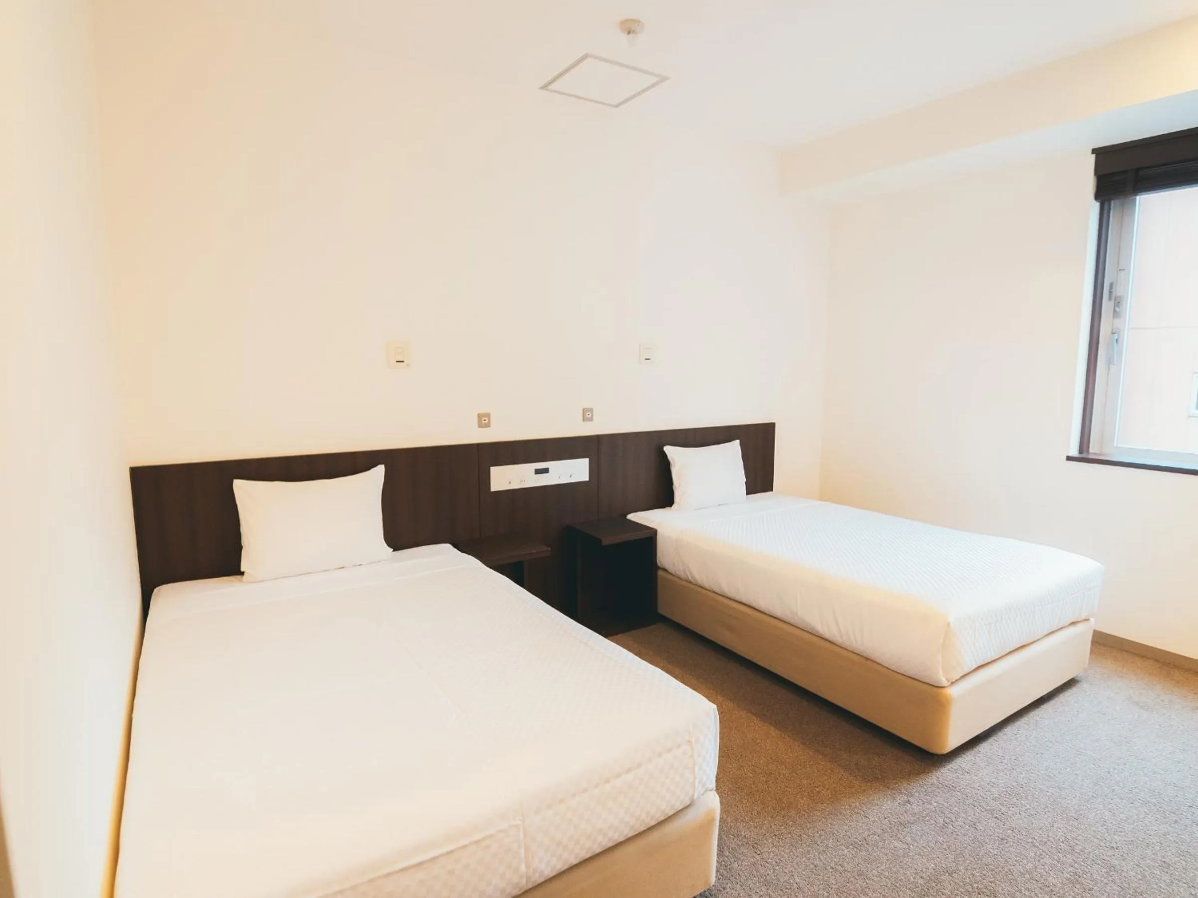 Bed in Quintessa Hotel Kokura Comic & Books