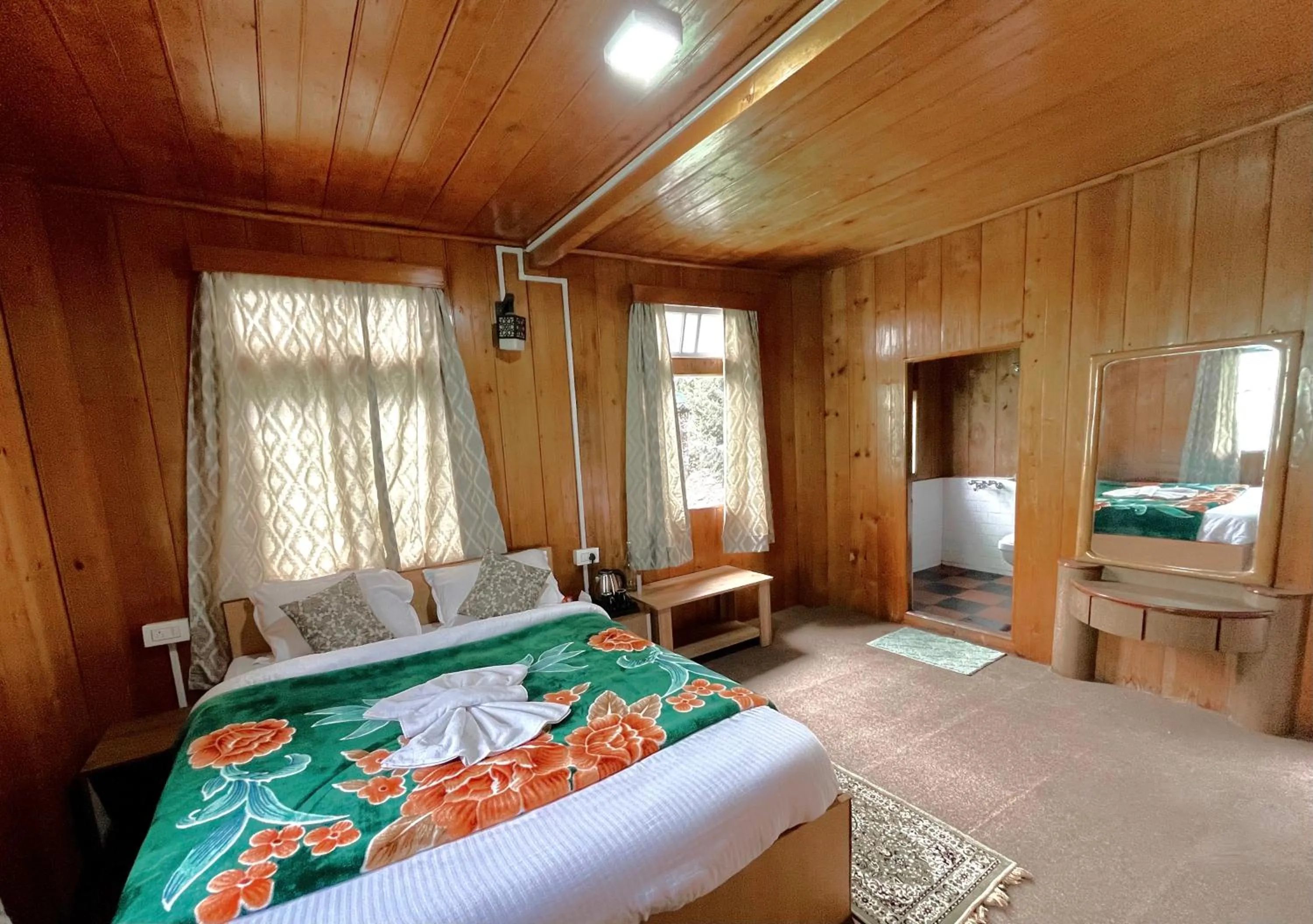 Bed in Apple Valley Cottages Lachung