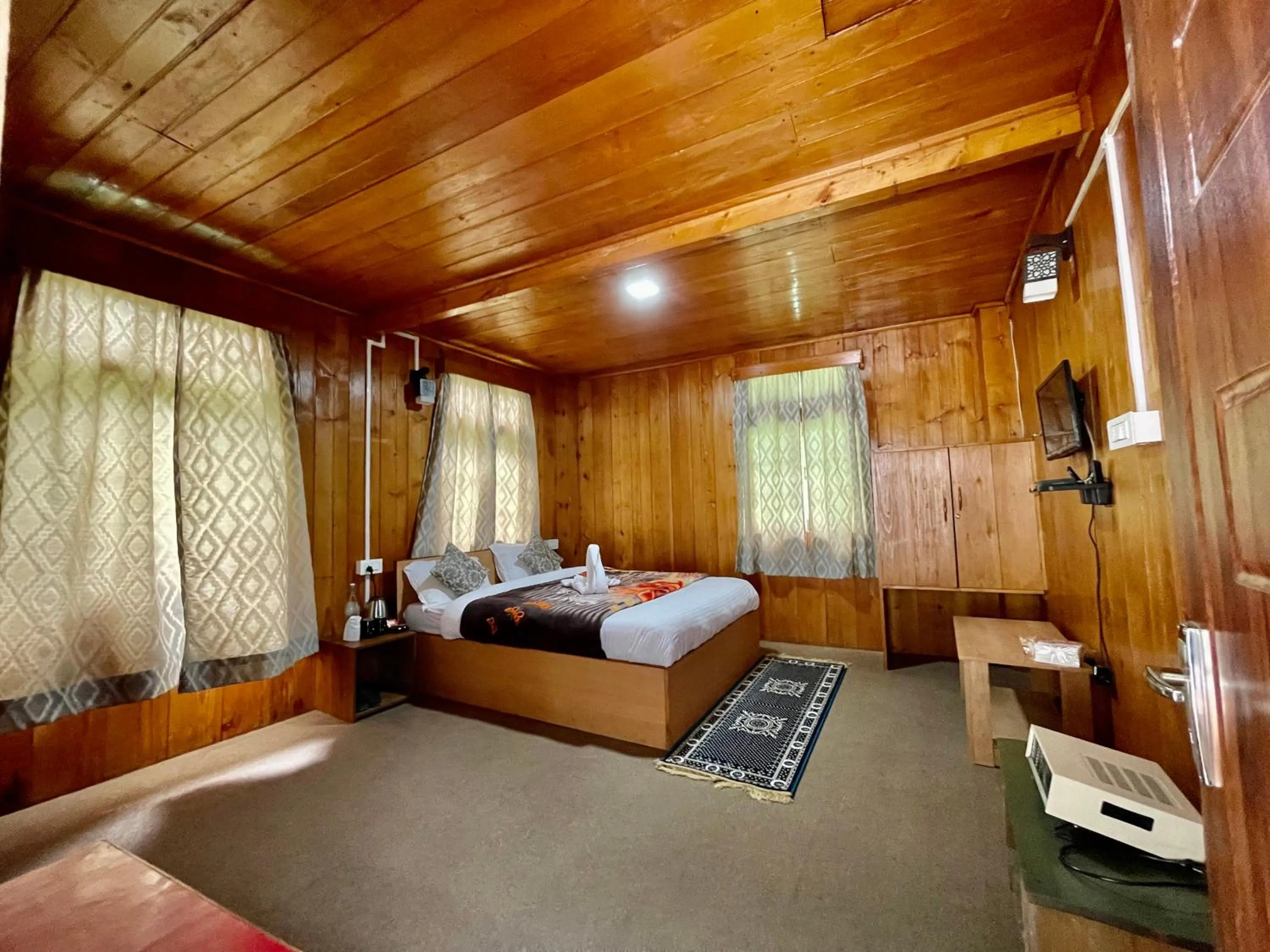 Bedroom in Apple Valley Cottages Lachung