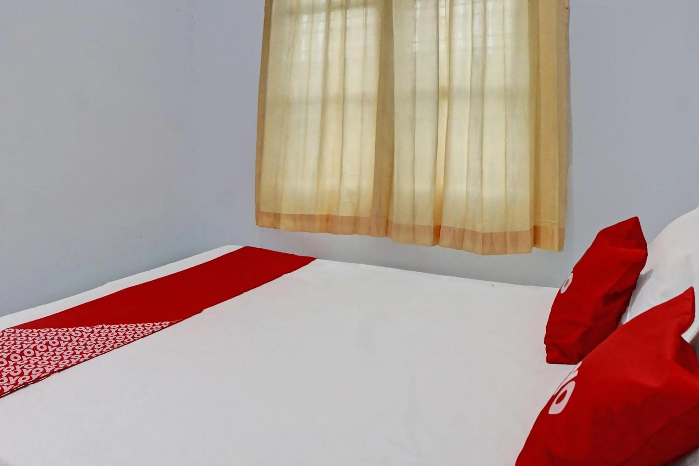 Bedroom in Hotel O Vania Guest HouseNearRSUP H Adam Malik