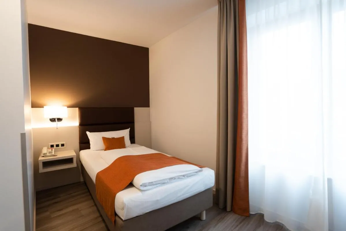 Bed in Hotel Kapuzinerhof