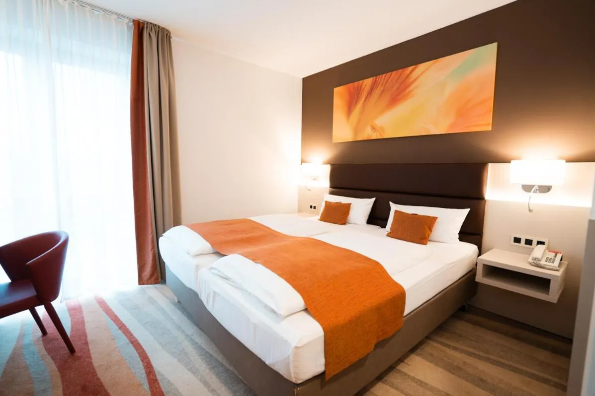 Bed in Hotel Kapuzinerhof