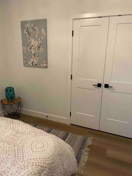 Bed in Adorable 1 Bedroom Suite- a skip to Galloping Goose