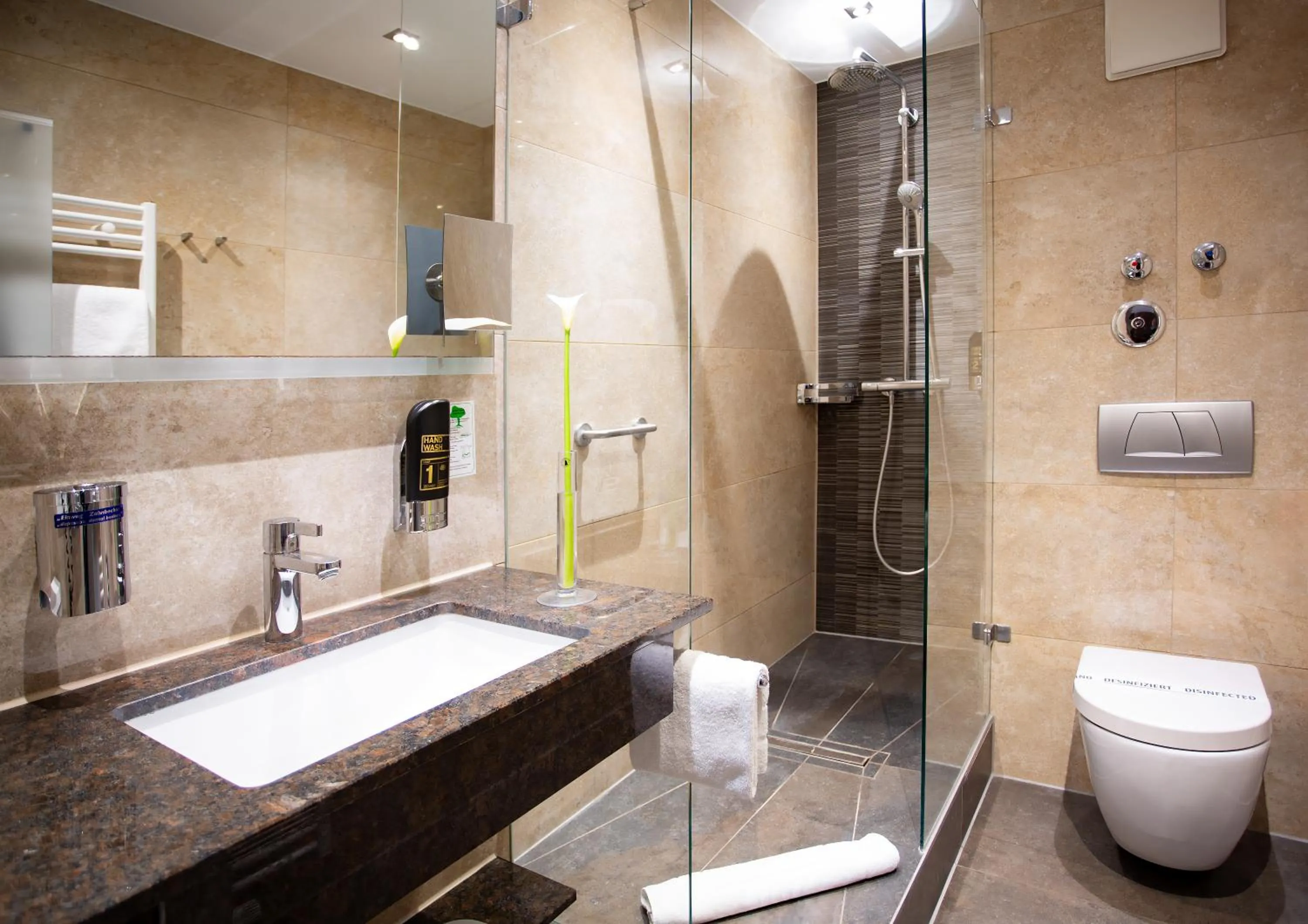 Bathroom in TIPTOP Hotel Burgschmiet Garni