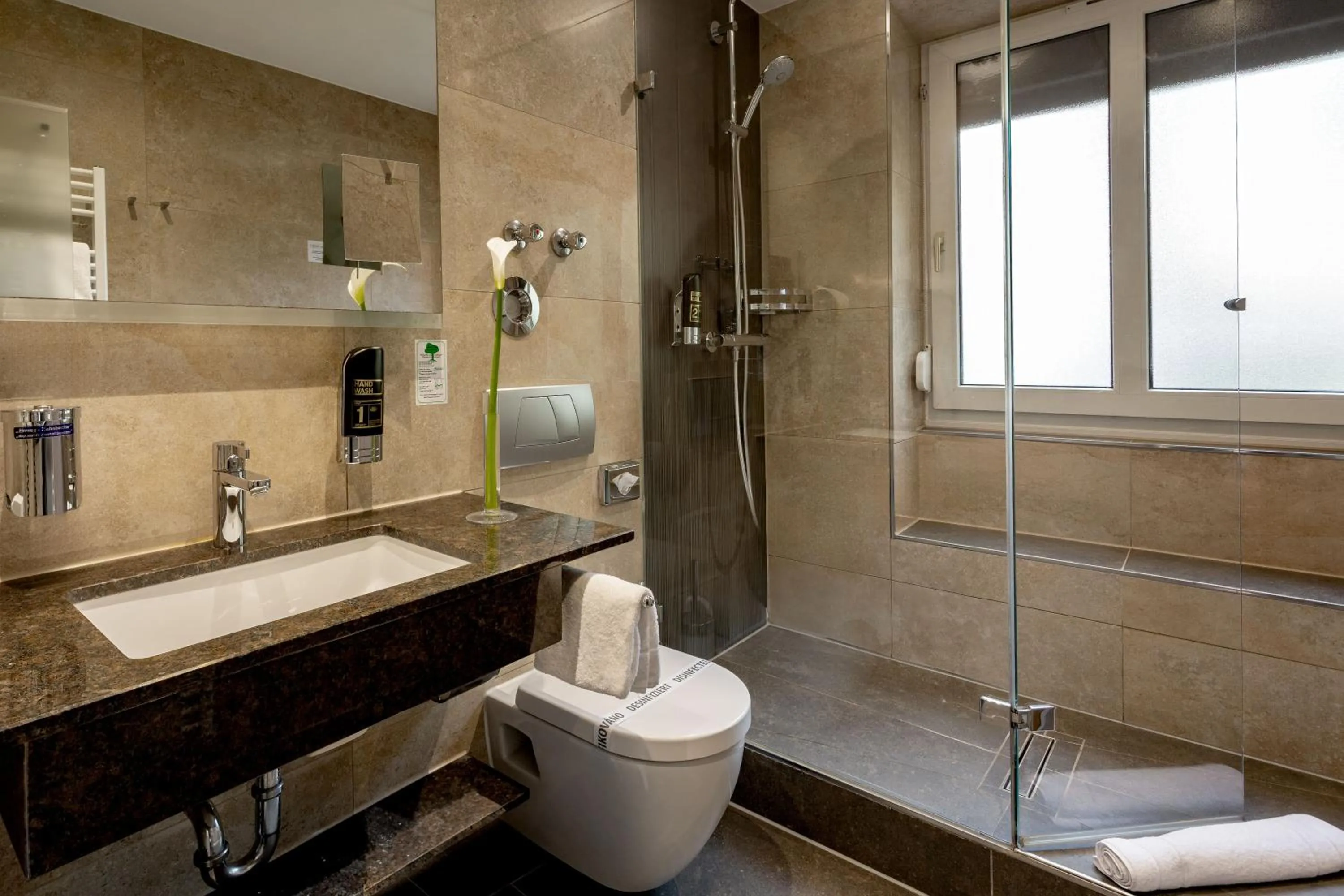 Bathroom in TIPTOP Hotel Burgschmiet Garni