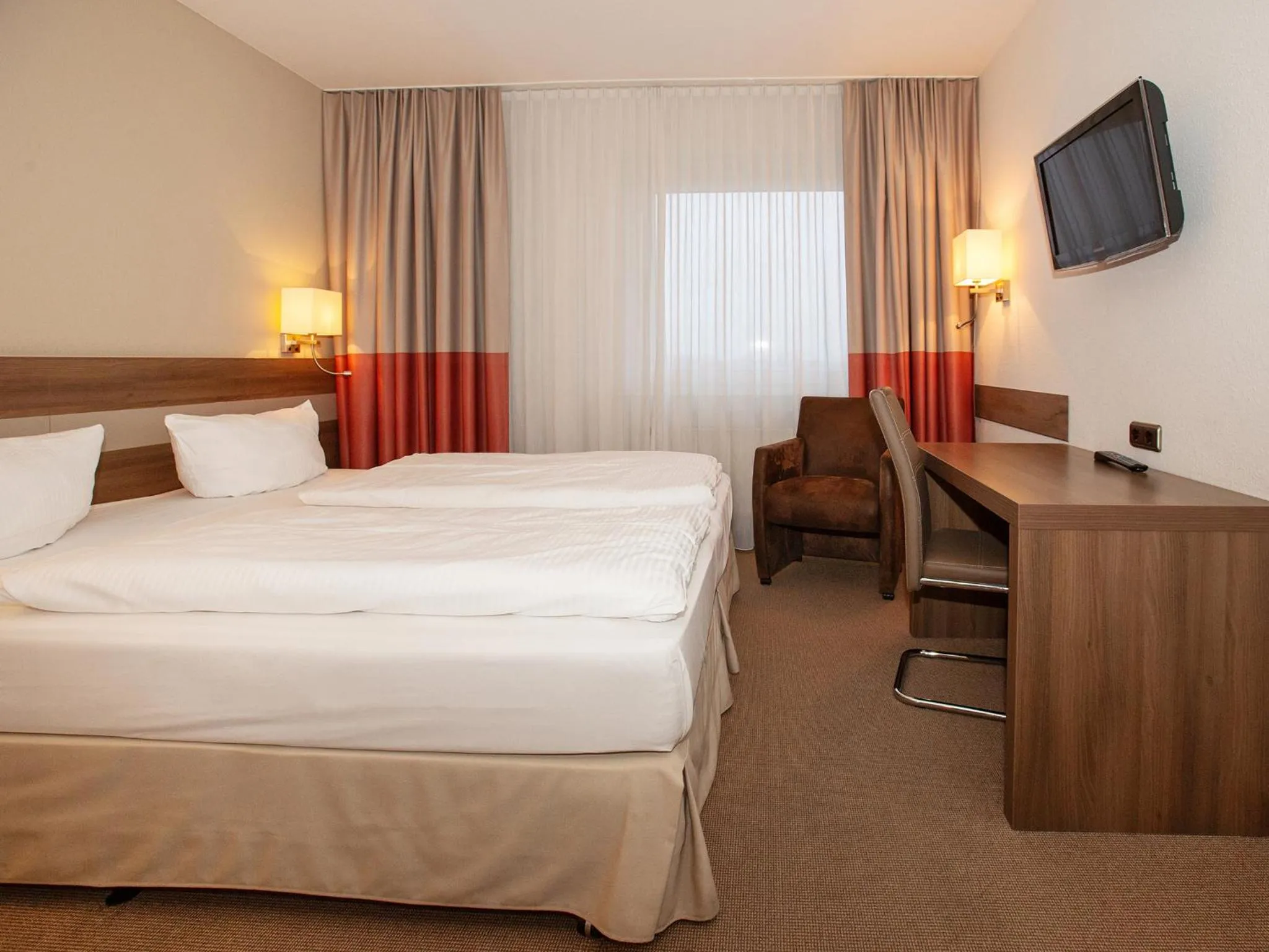 Photo of the whole room, Bed in DORMERO Hotel Greifswald