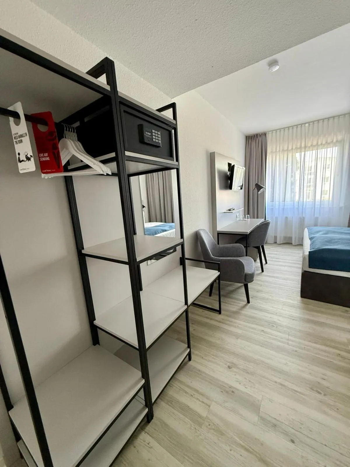 Bed in DORMERO Hotel Greifswald