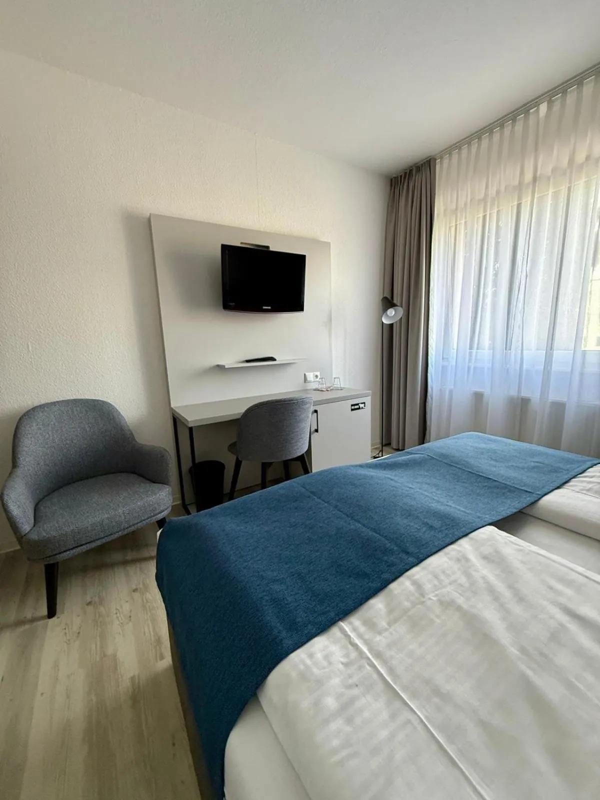 Bed in DORMERO Hotel Greifswald