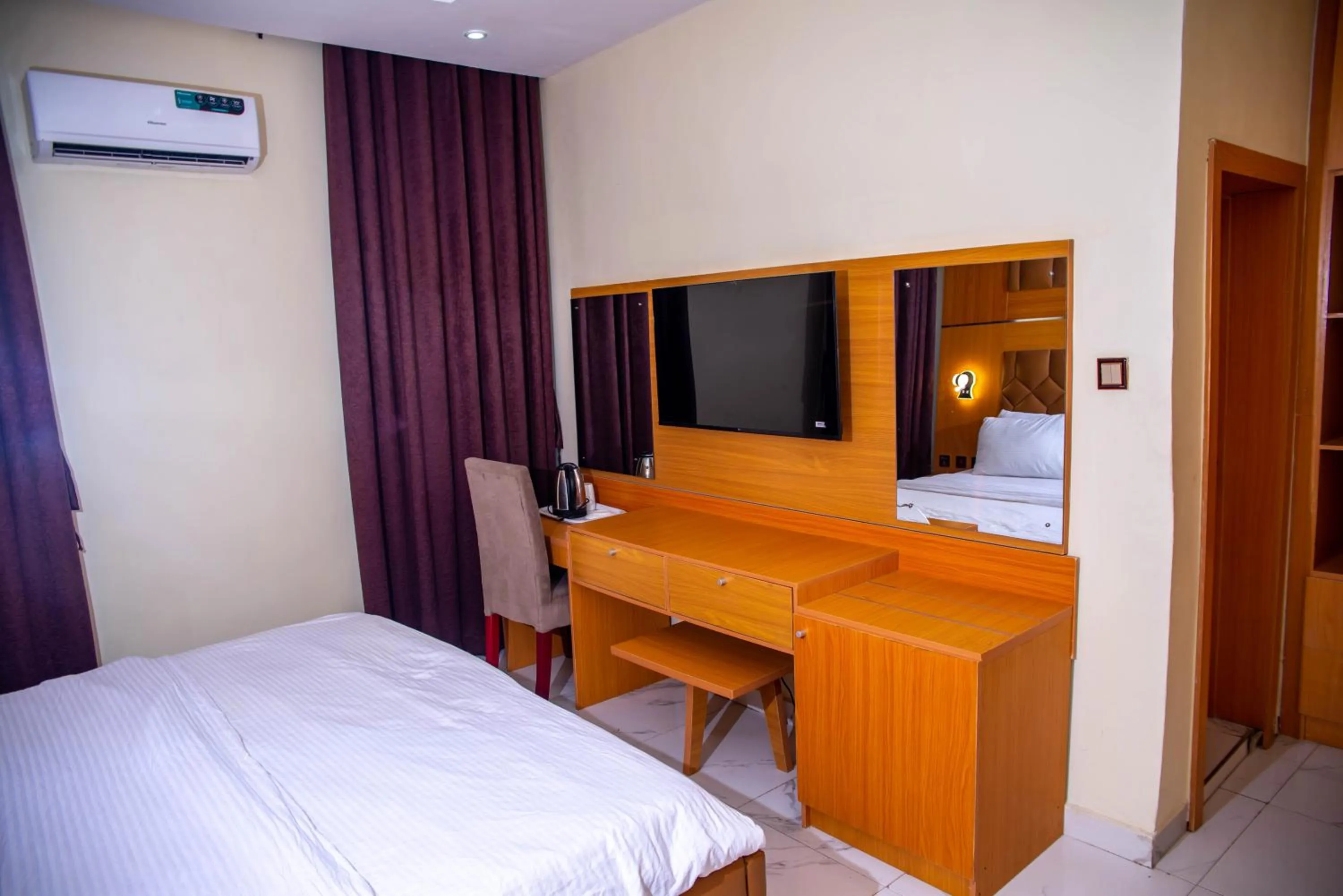 Bed in Buddiez Hotel & Resort