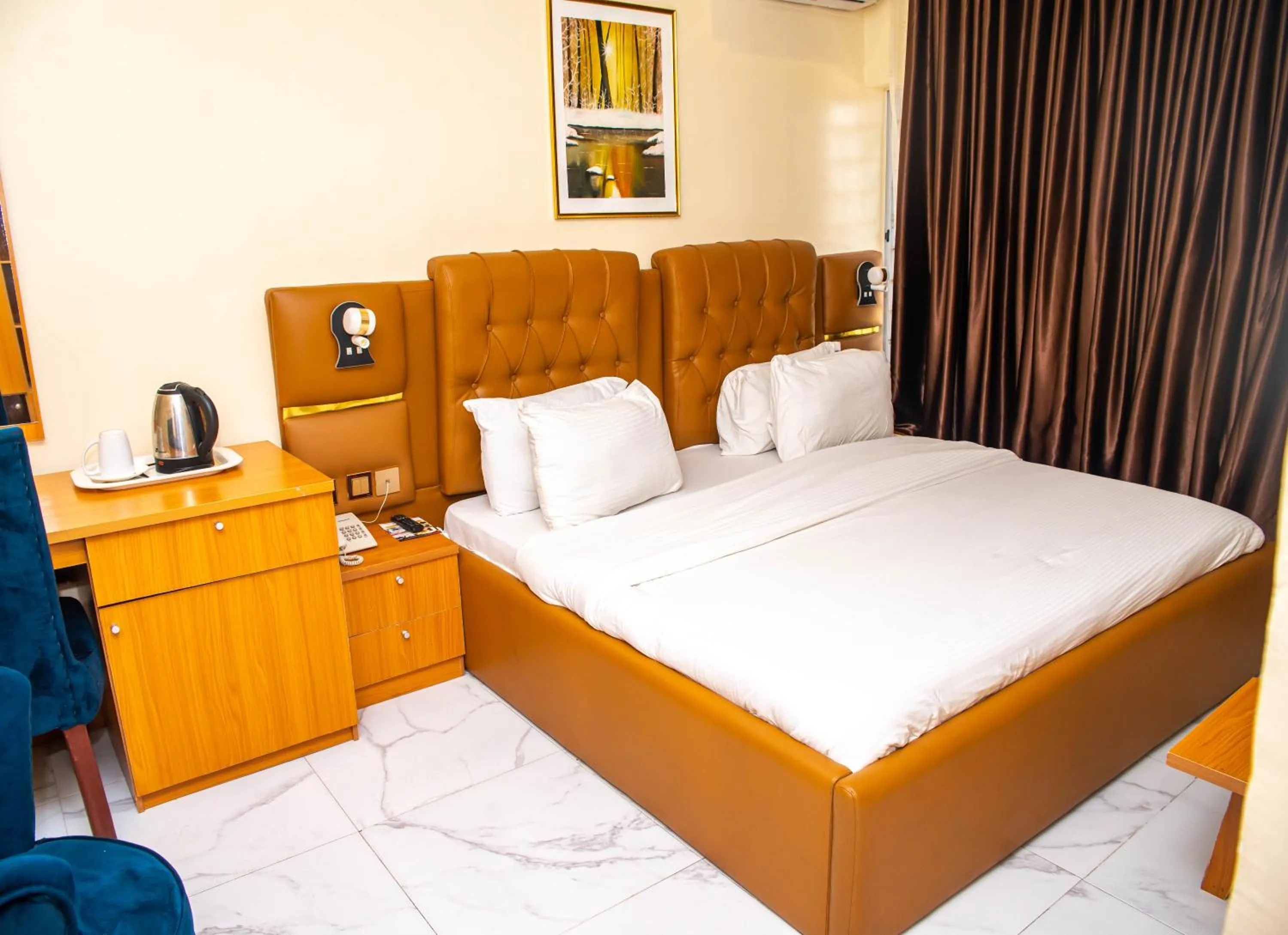 Bed in Buddiez Hotel & Resort