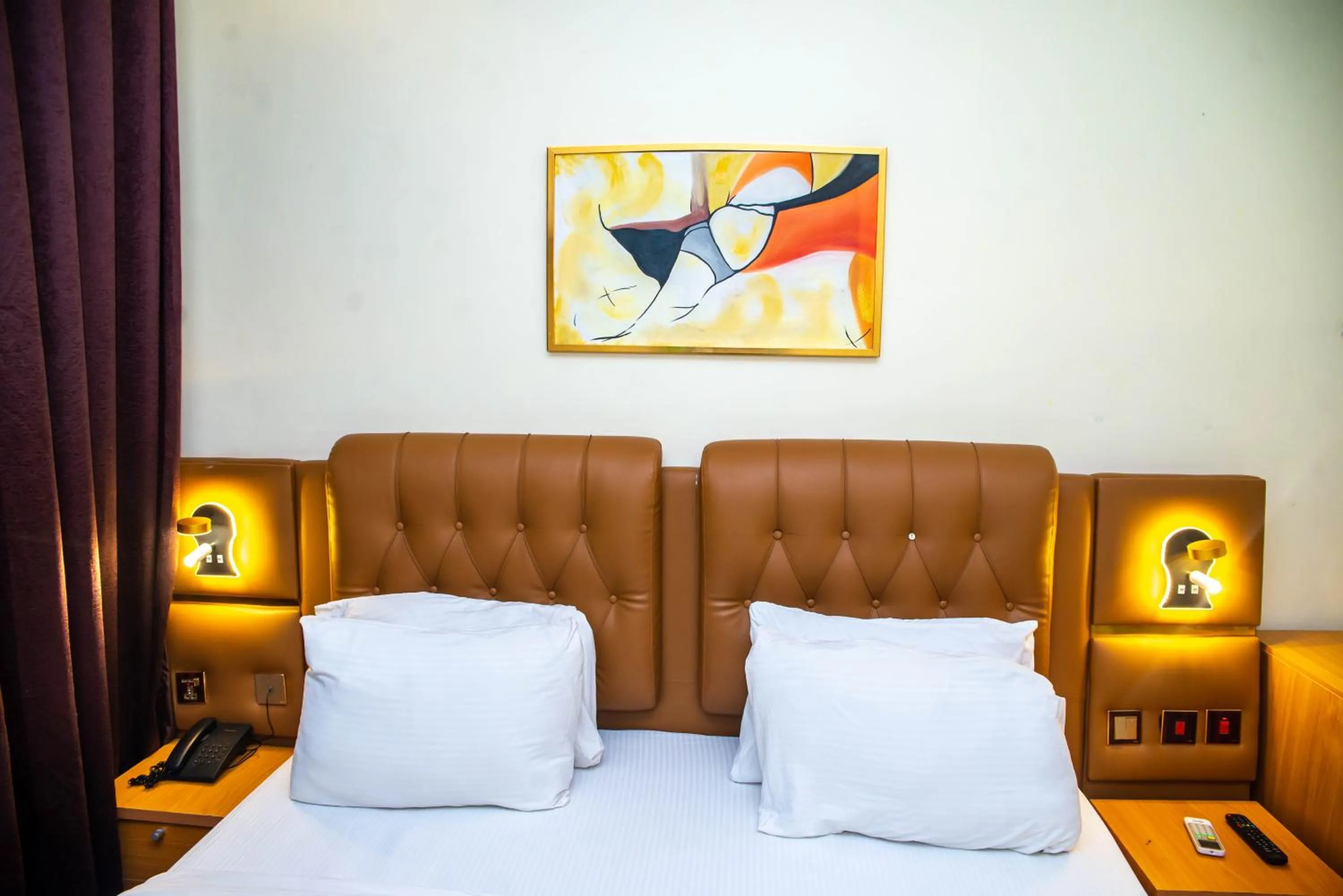 Bed in Buddiez Hotel & Resort