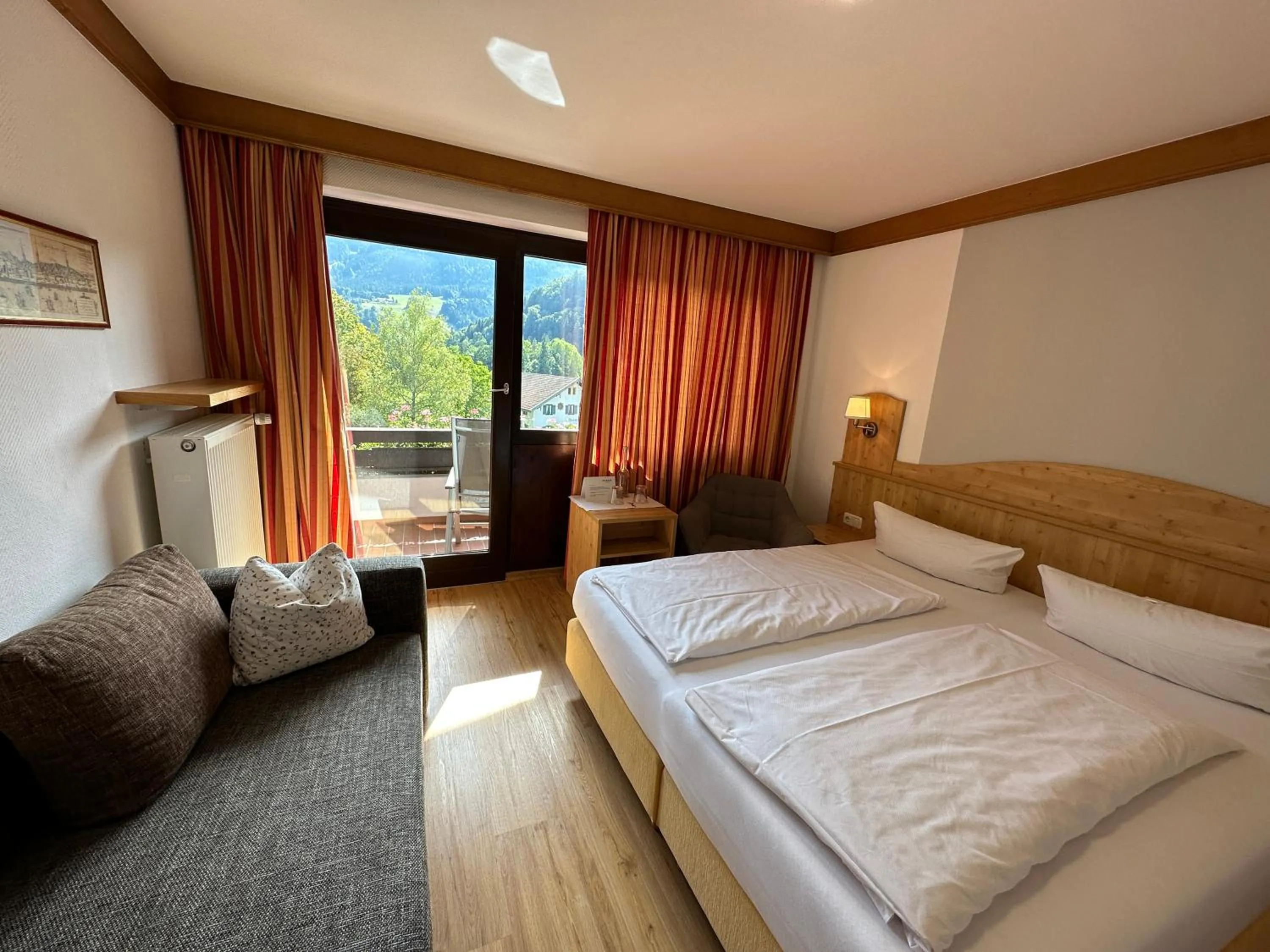 Photo of the whole room, Bed in Landhotel Maiergschwendt inkl Chiemgaukarte