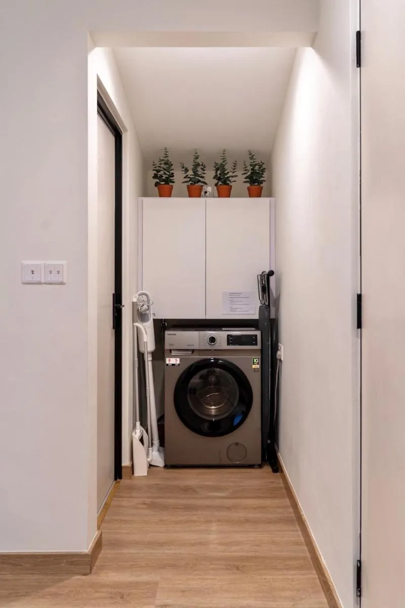 washing machine in Codrington House - Boutique Apartments