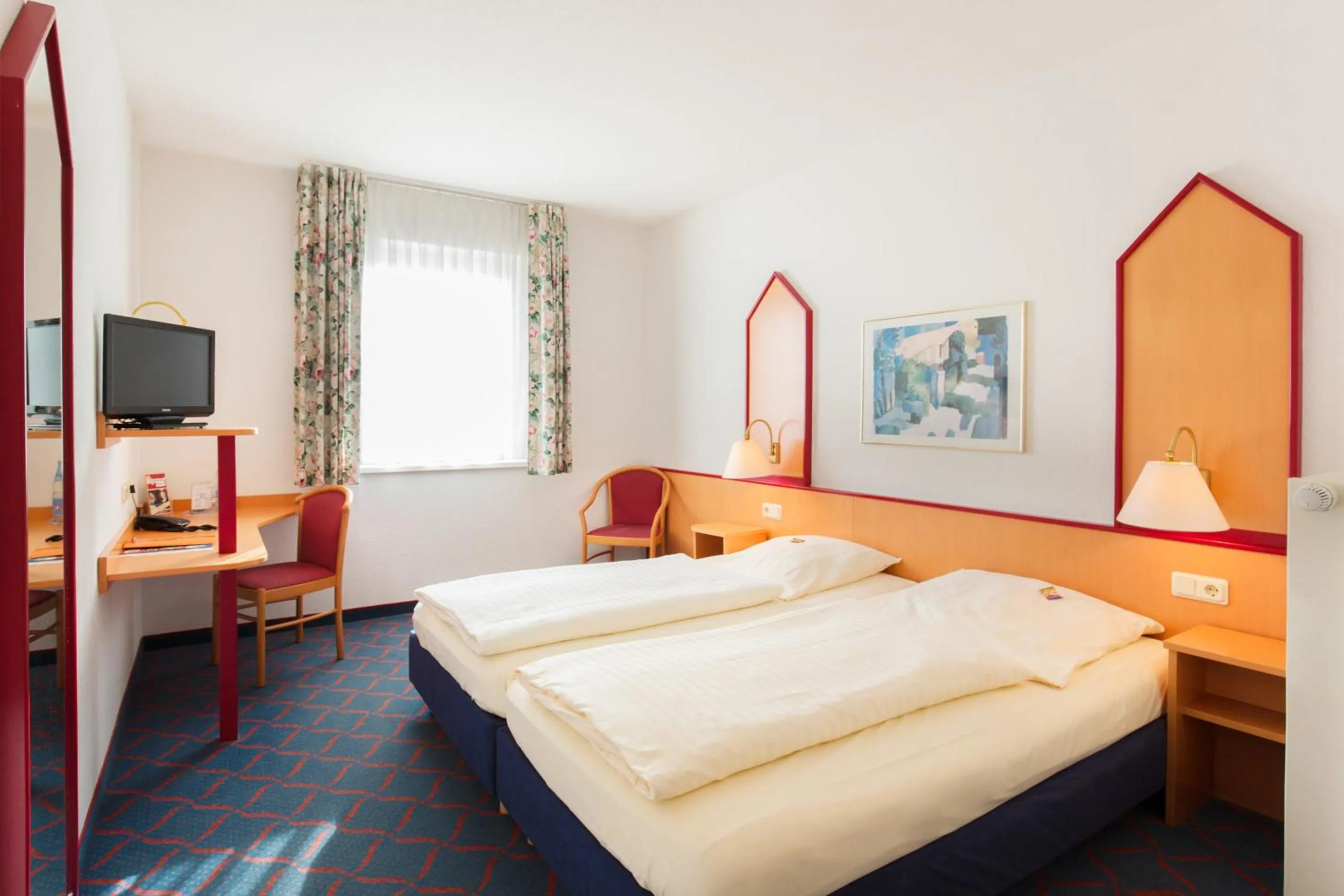 Photo of the whole room, Bed in Hotel Montana Lauenau