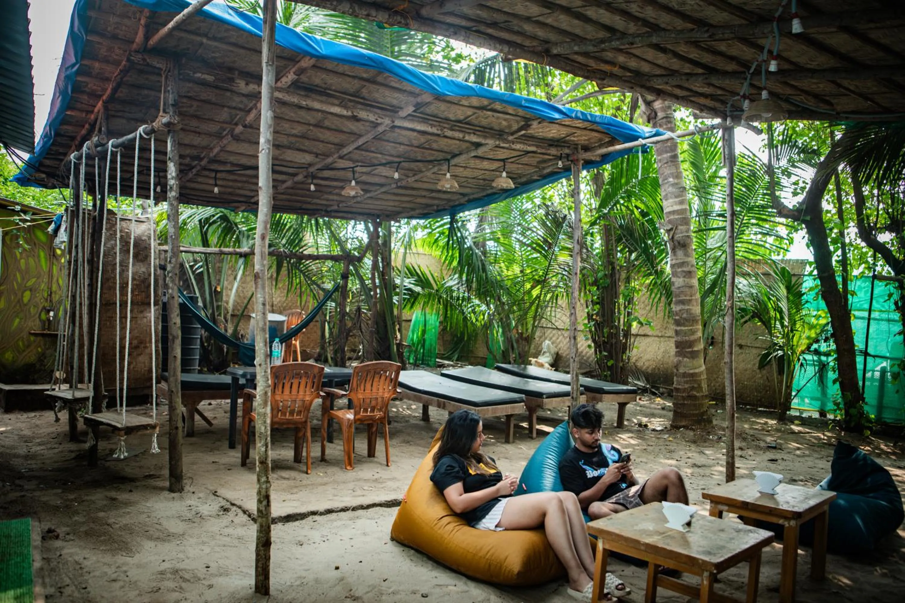 Communal lounge/ TV room in 12 Monks - Beachfront Hostel