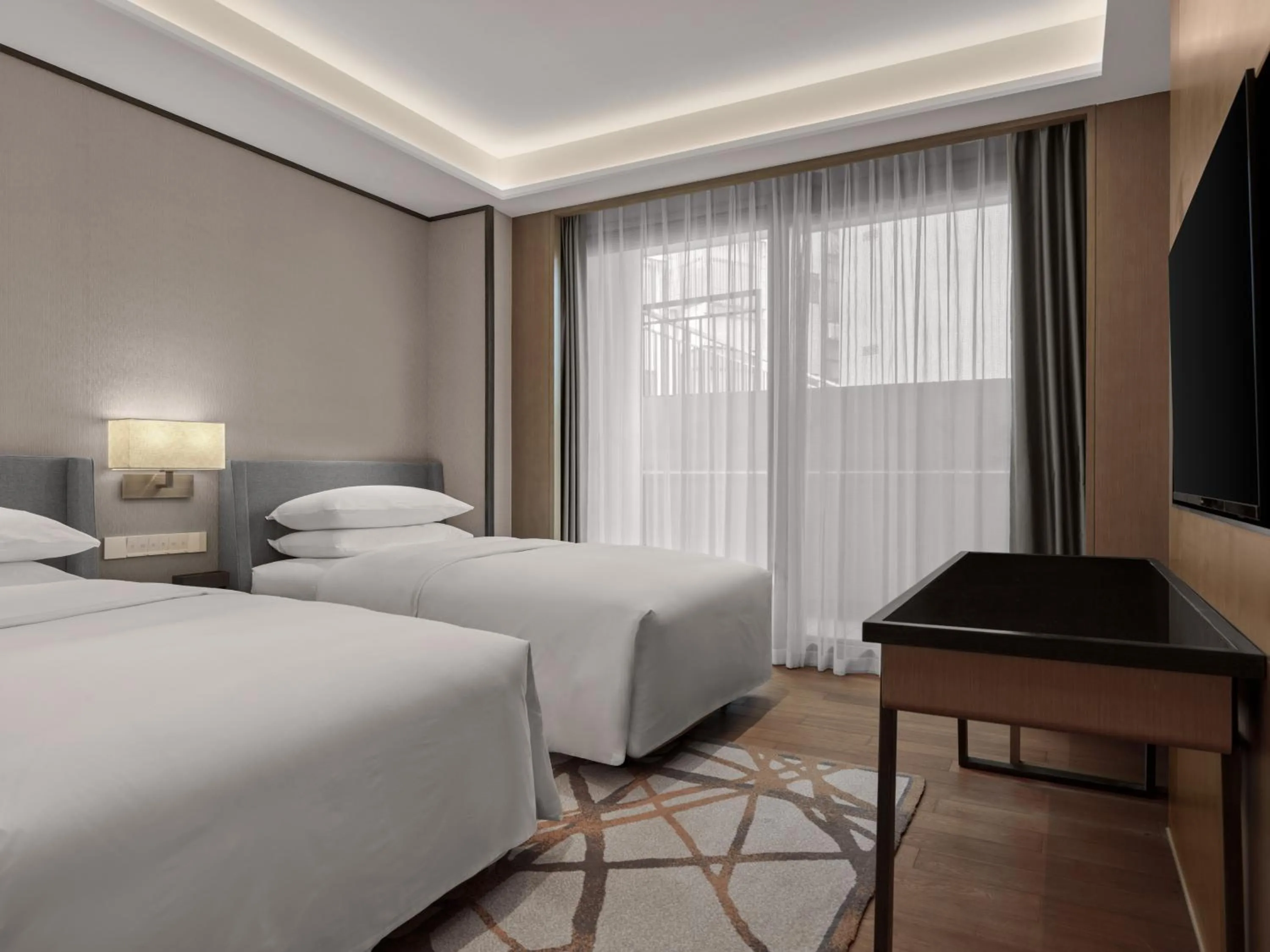 Bed in Dongguan Marriott Hotel