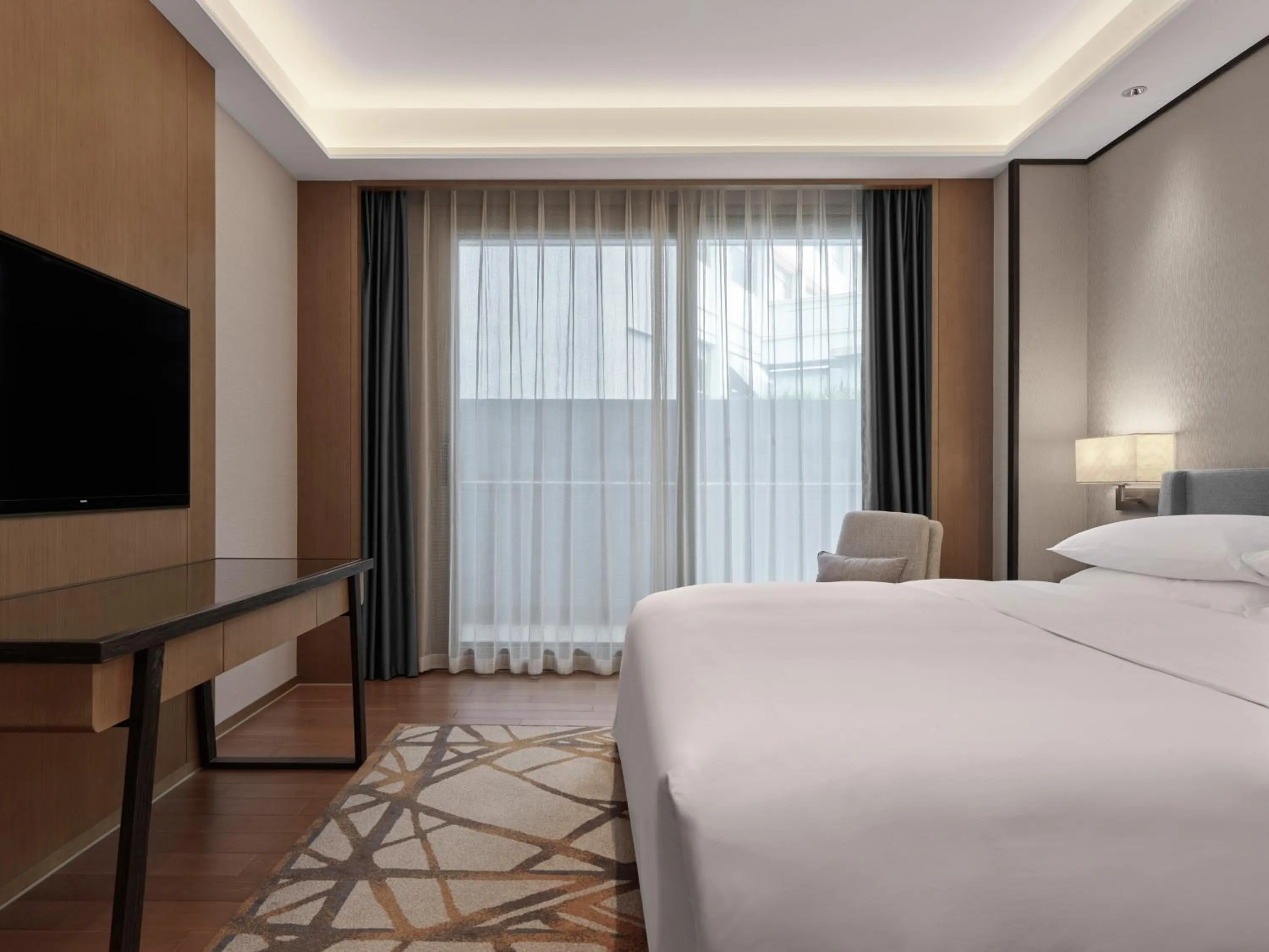 Bed in Dongguan Marriott Hotel