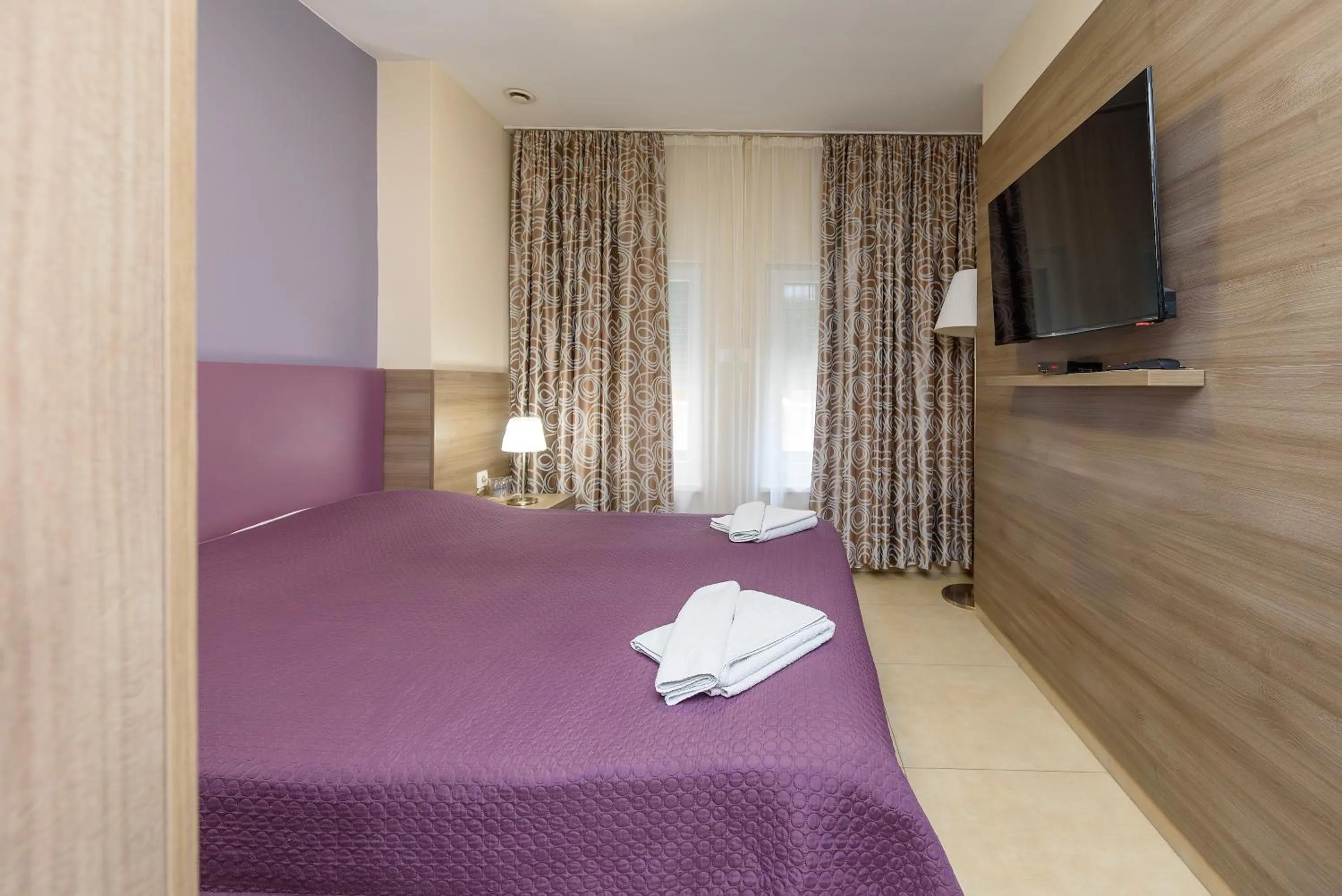 Bed in Garni Hotel Zenit